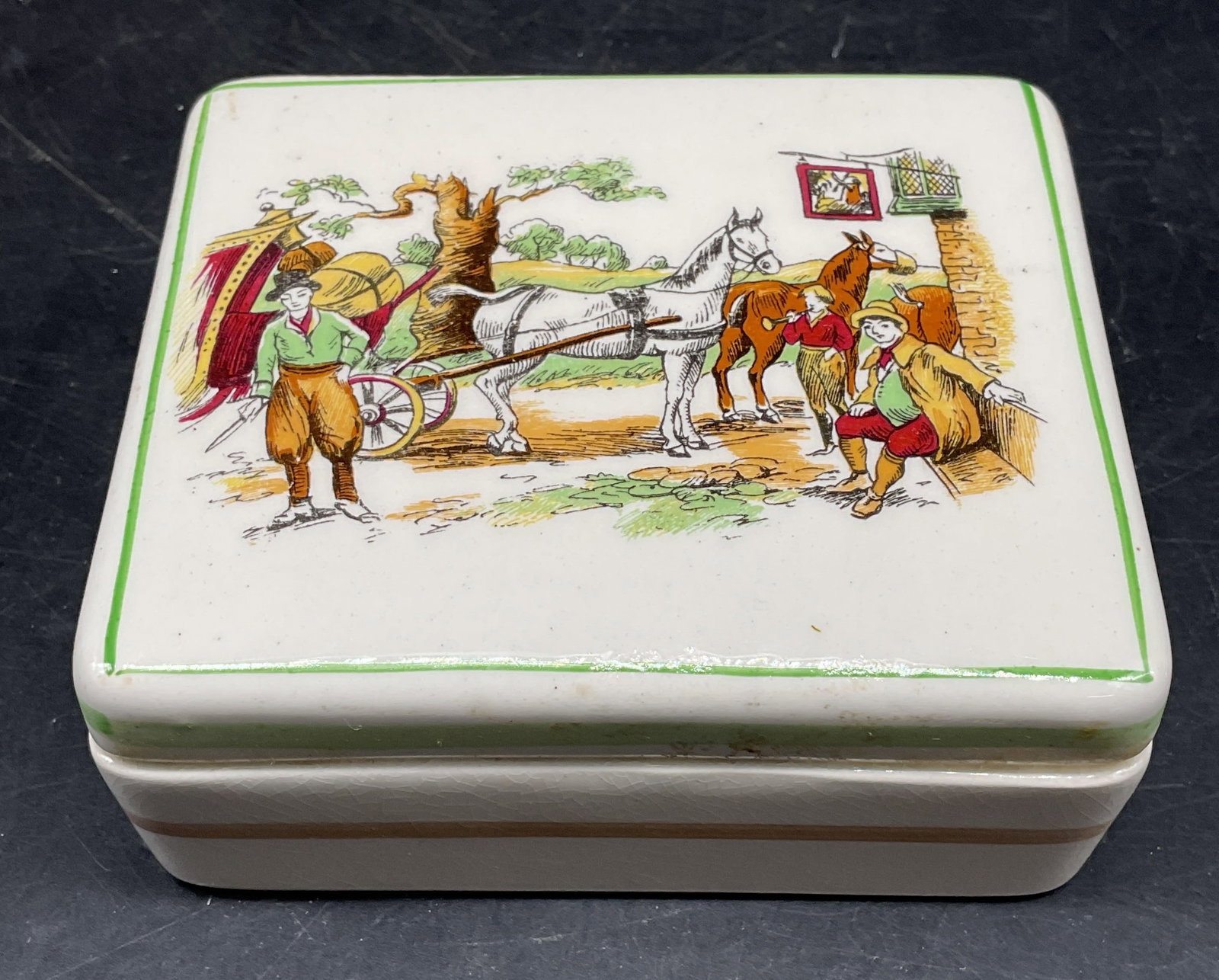 PV Ceramic Horse & Carriage Trinket Box England: Vintage PV ceramic trinket box with horse and carriage motif. Made in England. Hand painted. Measures approx. 4 x 3.5 x 1.5 inches. Wear including scratching and crazing. PV trinket box, vintage trink
