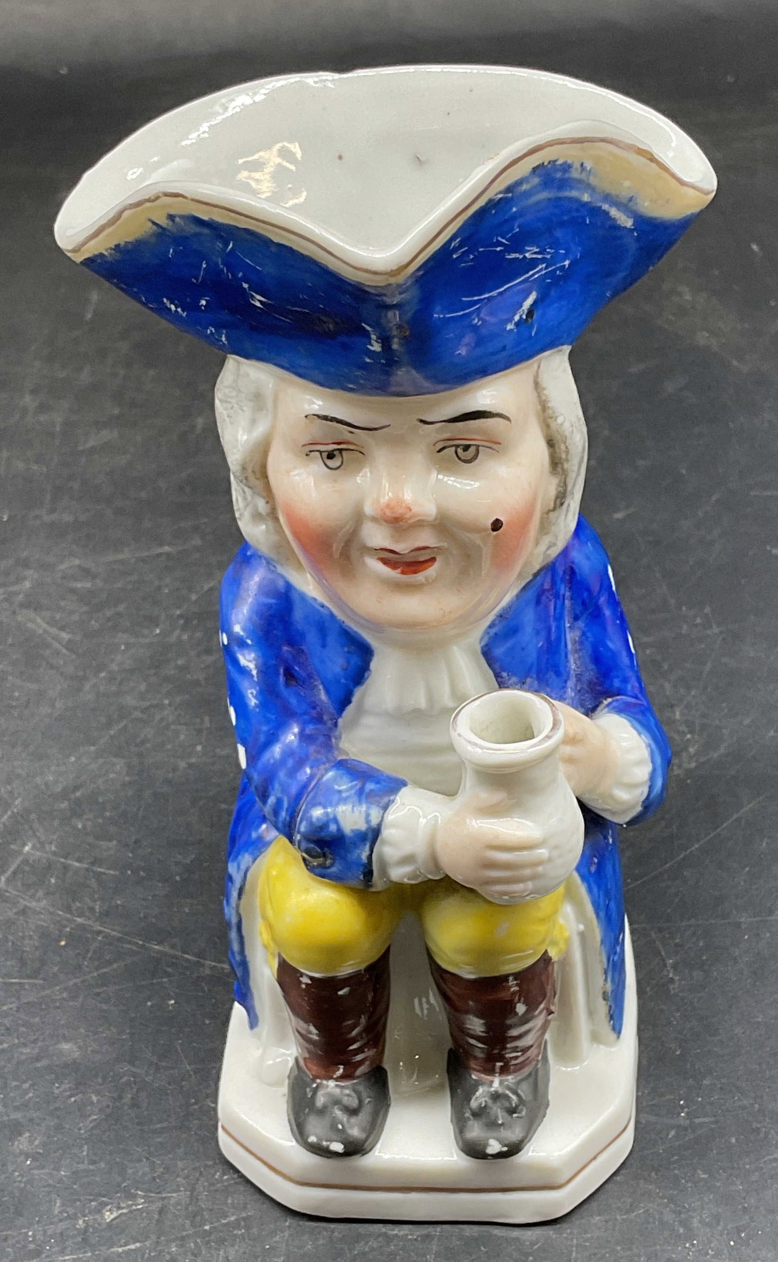 Chelsea Style English Porcelain Toby Jug: Hand painted porcelain Toby jd. Man with blue waistcoat. Gold anchor mark. Style of Chelsea Porcelain Factory. Measures approx. 3 x 3 x 5.25 inches. Some loss to paint and scratching. Toby jug, porcel