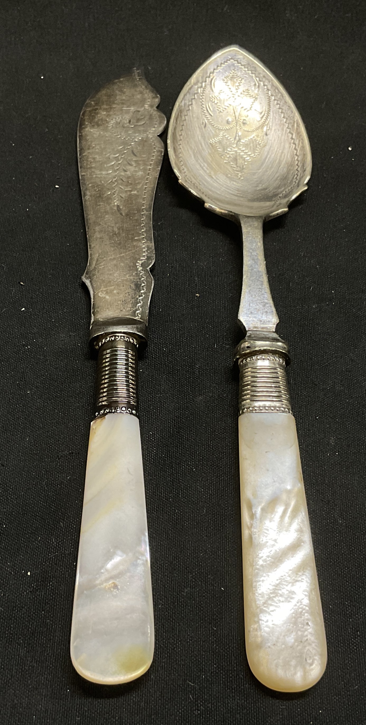VTG Mother-Of-Pearl Handled Silver-Plate Flatware: Vintage Victorian Style Mother-Of-Pearl of Pearl Handled Silver-Plate Flatware. Etched Details. Includes Spreader and Jam Spoon. Marked EPNS. Tarnishing Present. Measures app 6.5in H x 1in W. Vintage,