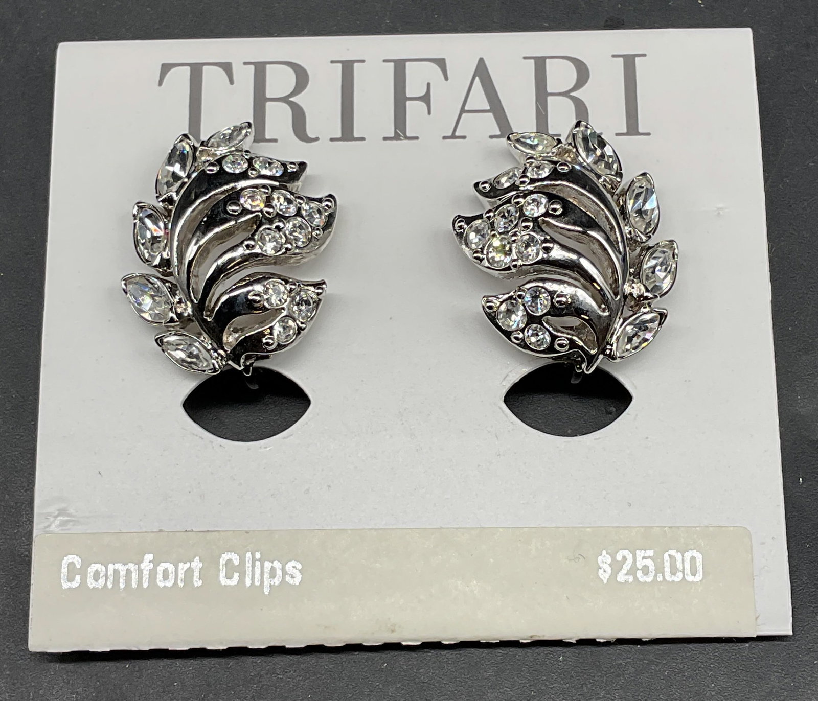 Trifari Silver Tone Rhinestone Earrings NWT: Trifari silver tone and rhinestone botanical earrings. New with tag. Measures approx. 1 inch long. Some scratching. Jewelry, estate jewelry, costume jewelry, cocktail jewelry, fashion jewelry, accesso