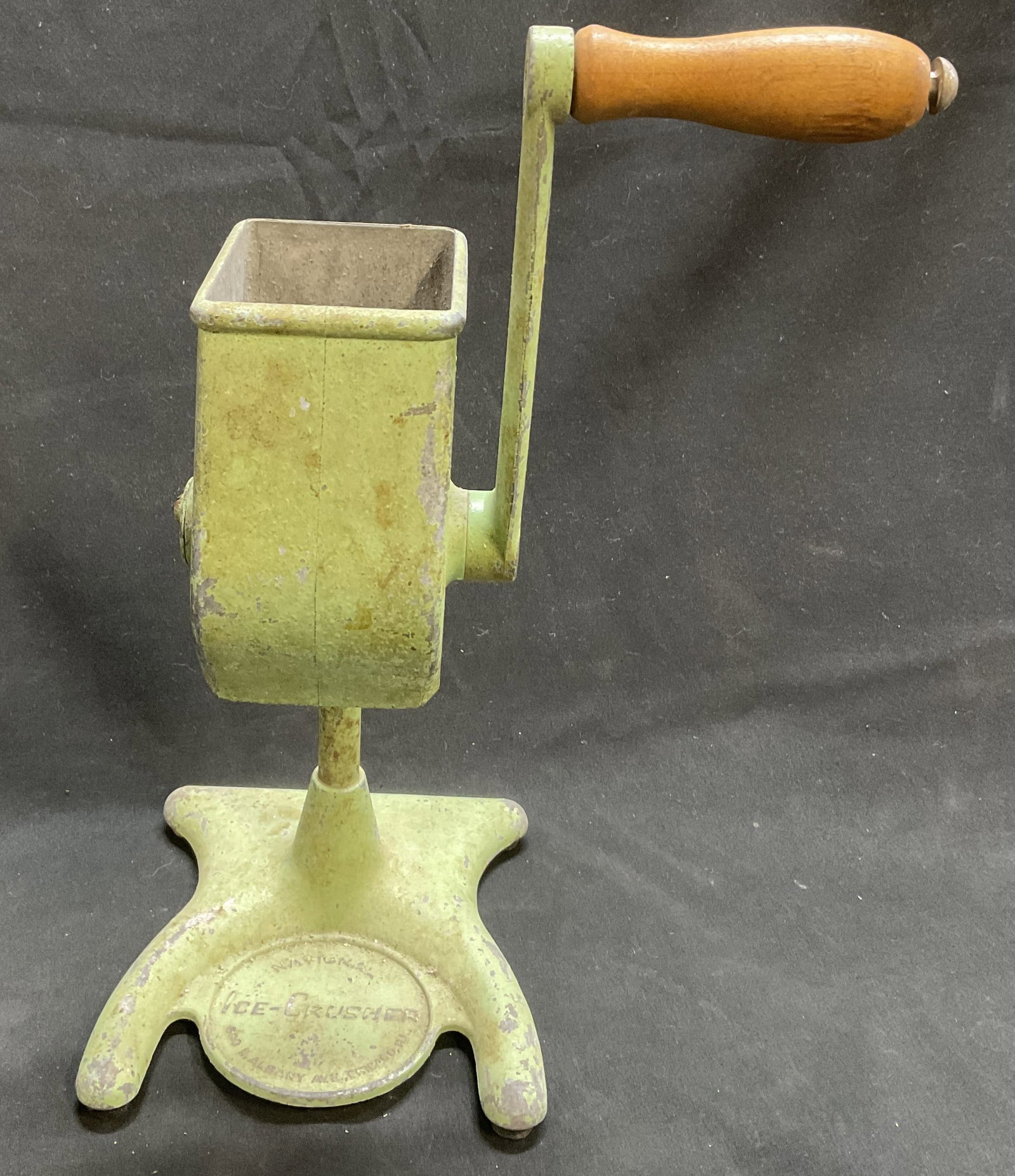 VTG 30s-50s National Metal Crank Ice Crusher: Vintage Circa 1930s-1950s National Brand Hand Crank Ice Crusher. Mixed Metal Alloy with Avocado Green Finish. Aging to Metal and Paint Peeling Present. Measures app 11.25in H with Handle Upright x 5.5