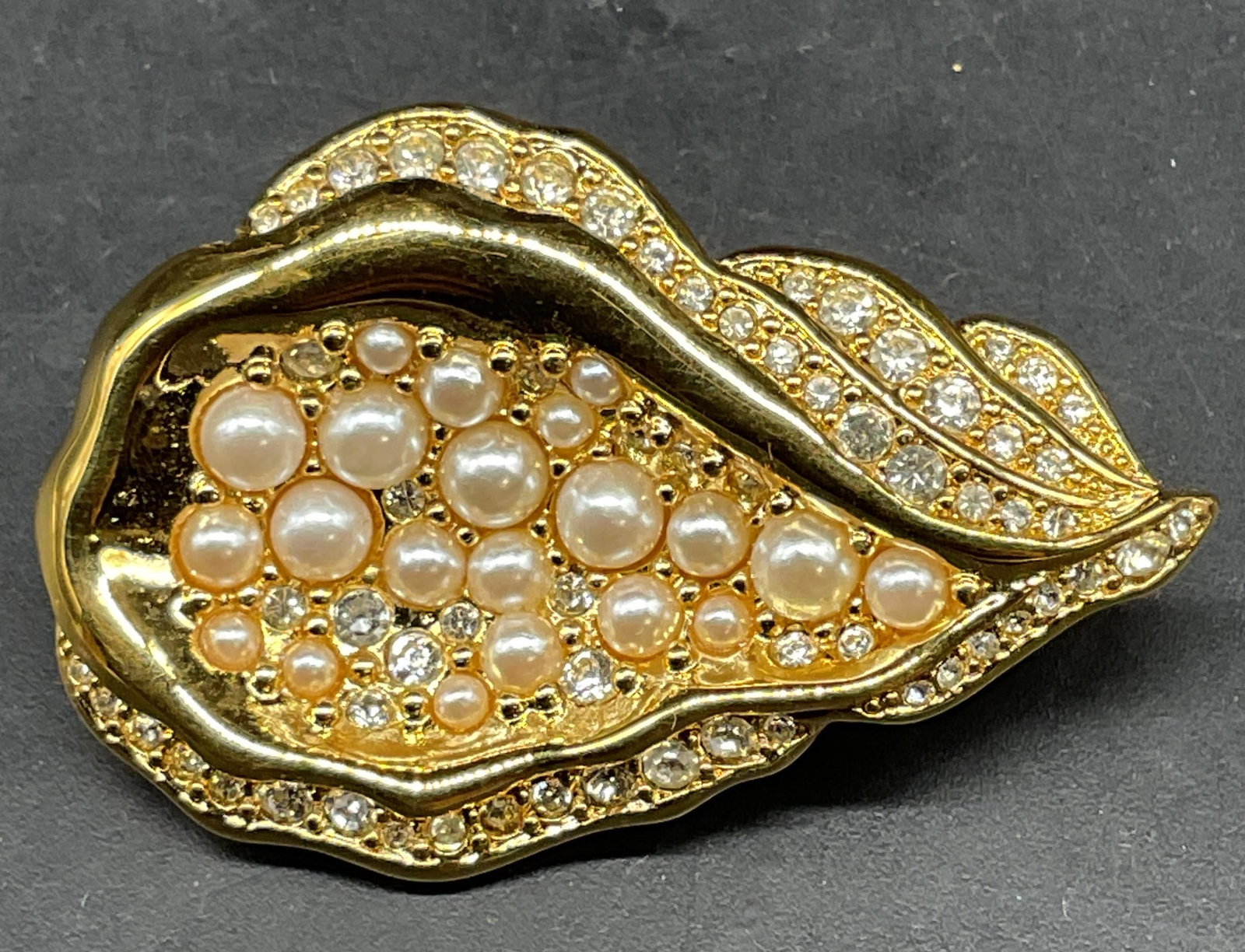 Napier Gold Tone Faux Pearl Oyster Brooch: Napier gold tone faux pearl and rhinestone oyster motif brooch. Measures approx. 1.75 x 1.25 inches. Some scratching. Jewelry, estate jewelry, costume jewelry, cocktail jewelry, fashion jewelry, acces