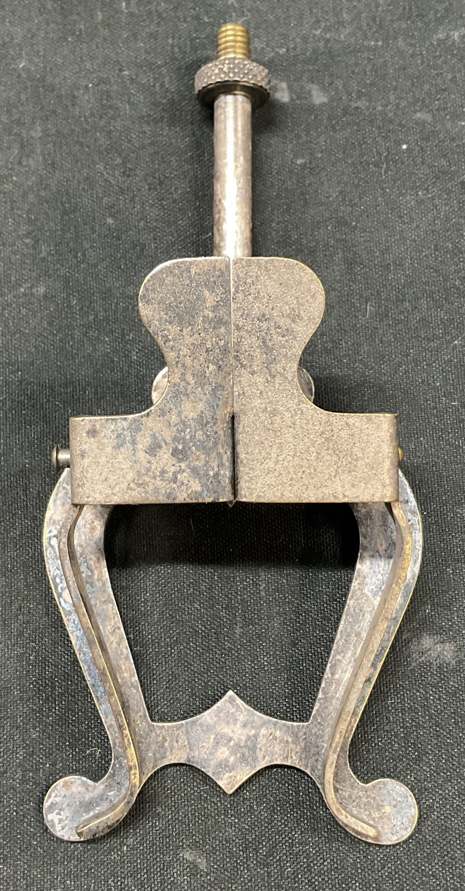 Antq Metal Sheet Music Holder Clip: Antique metal sheet music holder clip. Post to attach to a music stand. Clip operates with springs to hold papers in place. Measures approx 2 x 4 inches. Not tested for function, sold as is. Surface w