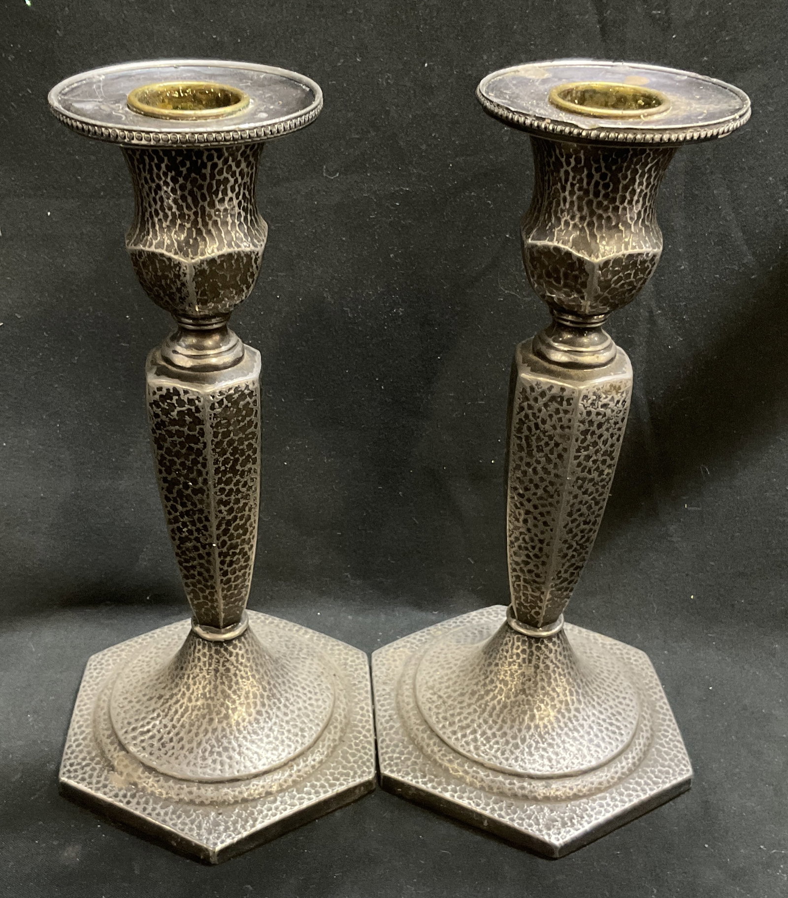 Lt2 ANTQ JB C20s-30s Slvr-Pltd Candlestick Holders: 2 Antique Circa 1920s-1930s JB Art Deco Style Silver-Plated Hammered Design Candlestick Holders. Hexagonal Bases. Scratching and Tarnishing Present. Measures app 7.75in H x 3.5in Diam. Antique Candles