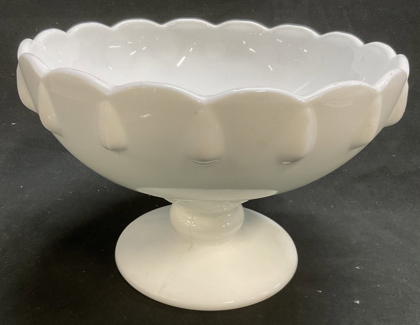 VTG 50s-70s Milk Glass Scalloped Pedestal Bowl: Vintage Circa 1950s-1970s Milk Glass Scalloped Edge Pedestal Bowl. Teardrop Design. Condition Consistent With Exposure. Measures app 5in H x 7.75in Diam. Vintage Glassware, Milk Glass, 1950s, 1960s,