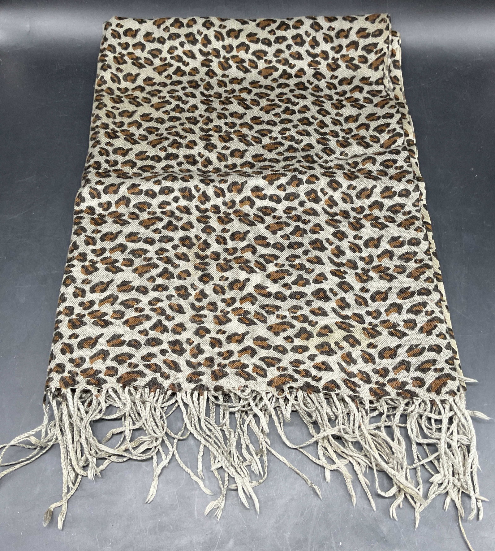 Grey Cheetah Print Wool Scarf: Grey cheetah print wool scarf with fringe. Measures approx. 68 inches long. Wear including pilling, blemishes, pulling. Cheetah print scarf, animal print scarf, grey scarf, wool scarf, accessories,