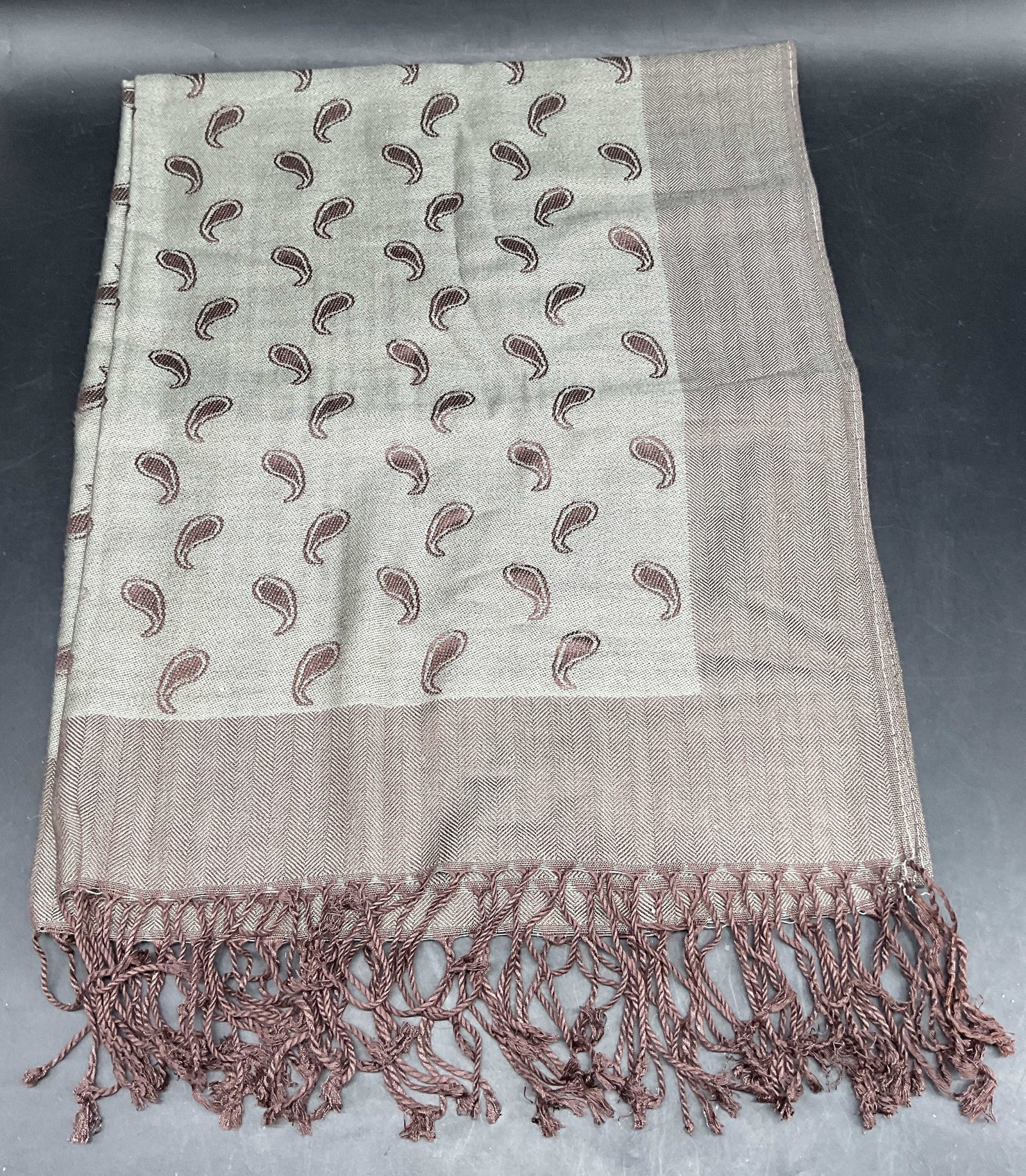 Grey Brown Paisley Pattern Wool Scarf: Grey and brown paisley pattern wool scarf with fringe. Measures approx. 68 inches long. Some wear consistent with exposure. Wool scarf, grey scarf, brown scarf, paisley scarf, accessories, fashion