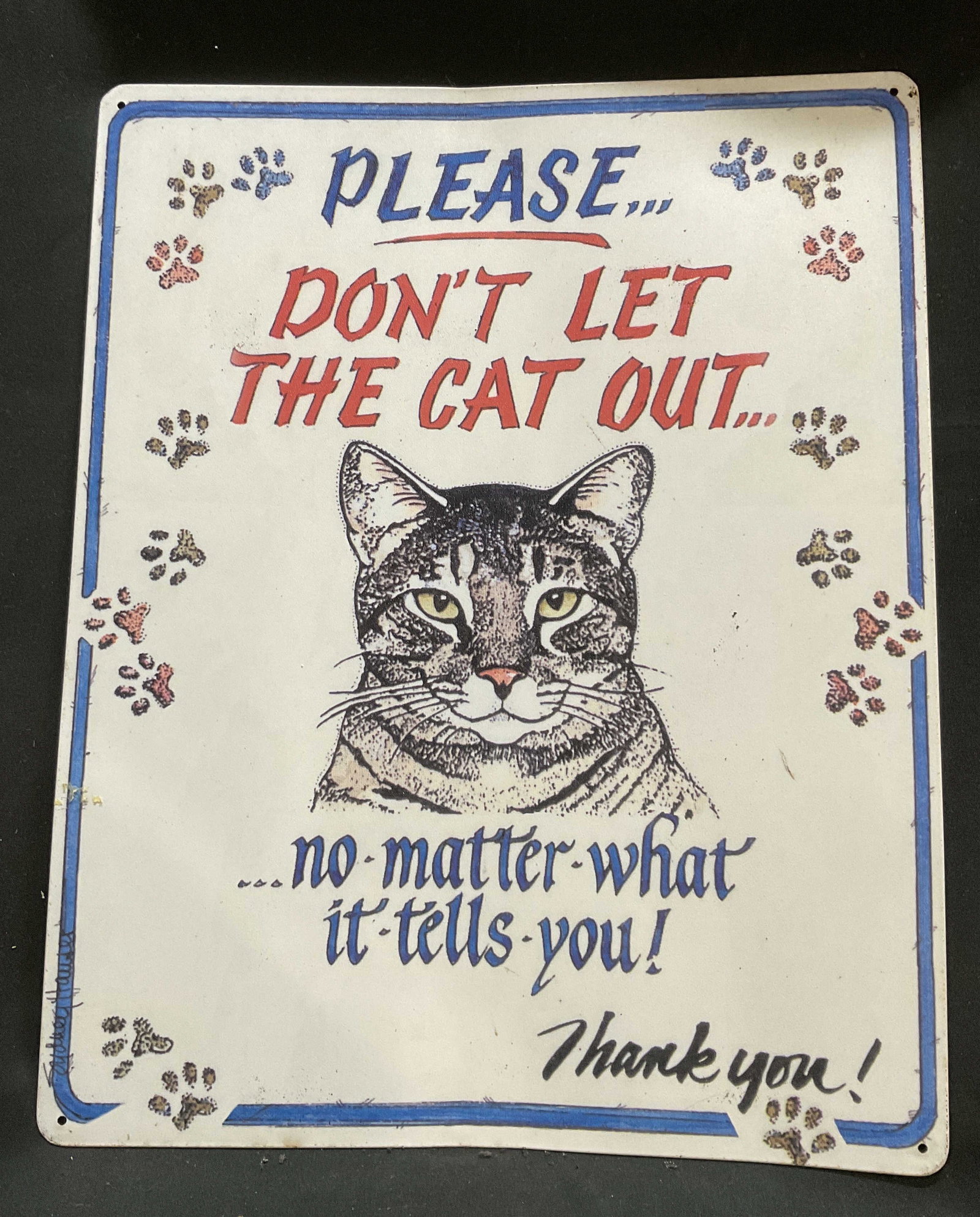 2005 Sign of the Times Sydney Hauser Cat Tin Sign: 2005 Sign of the Times Dont Let the Cat Out Tin Sign with Artwork by Sydney Hauser. Features Facsimile Signature. Scratching Present. Measures app 15in H x 12in L. 2000s, Sign of the Times, Cats, Tin