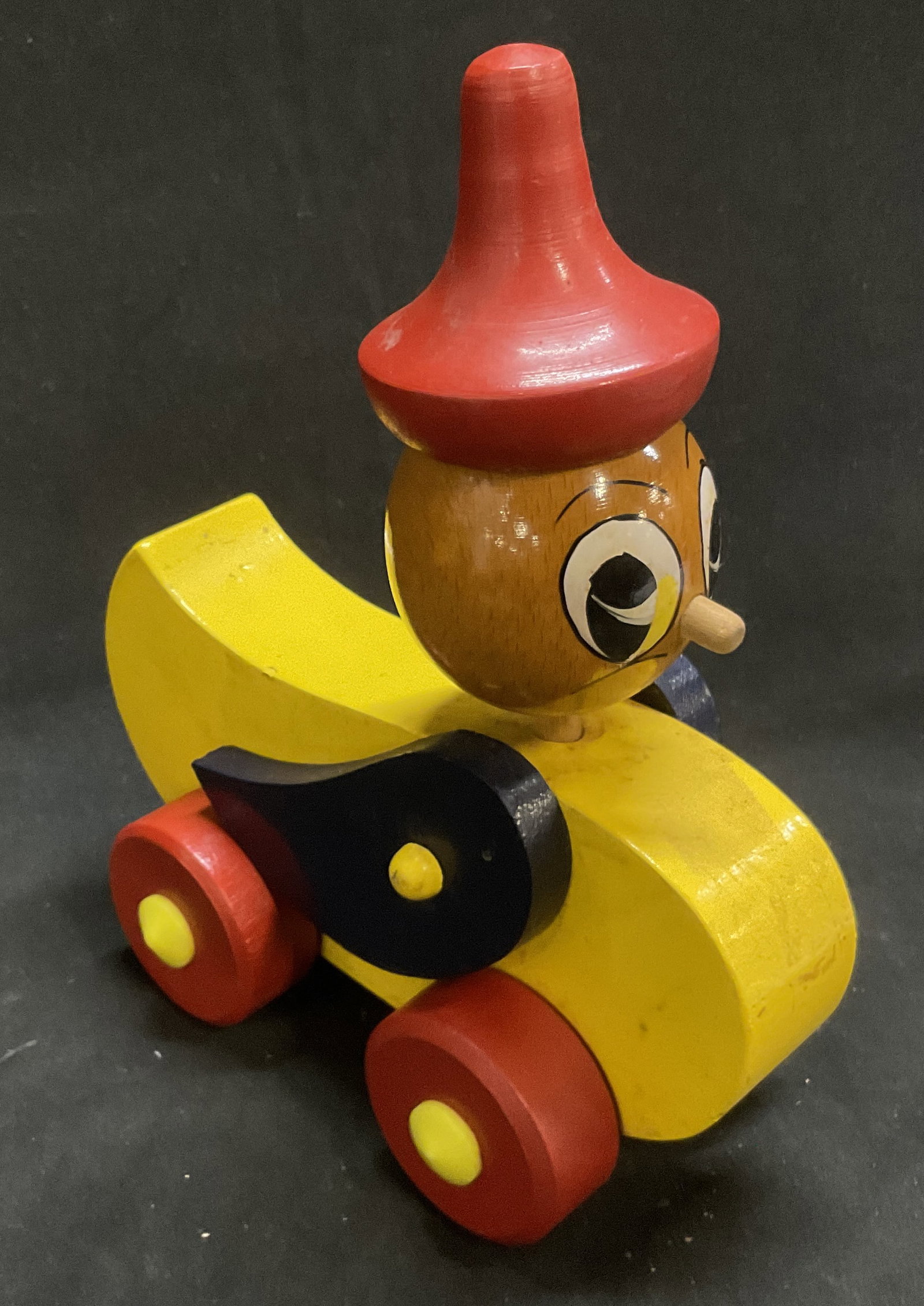 VTG 60s-70s Wooden Rolling Duck Toy ROMANIA: Vintage 1960s-1970s Wooden Rolling Duck Toy. Bright Red Pointed Hat and Yellow Body. Made in Romania. Some Losses. Measures app 8.5in H x 6.25in L. Vintage Toys, 1960s, 1970s, Wooden, Ducks, Birds, Wh