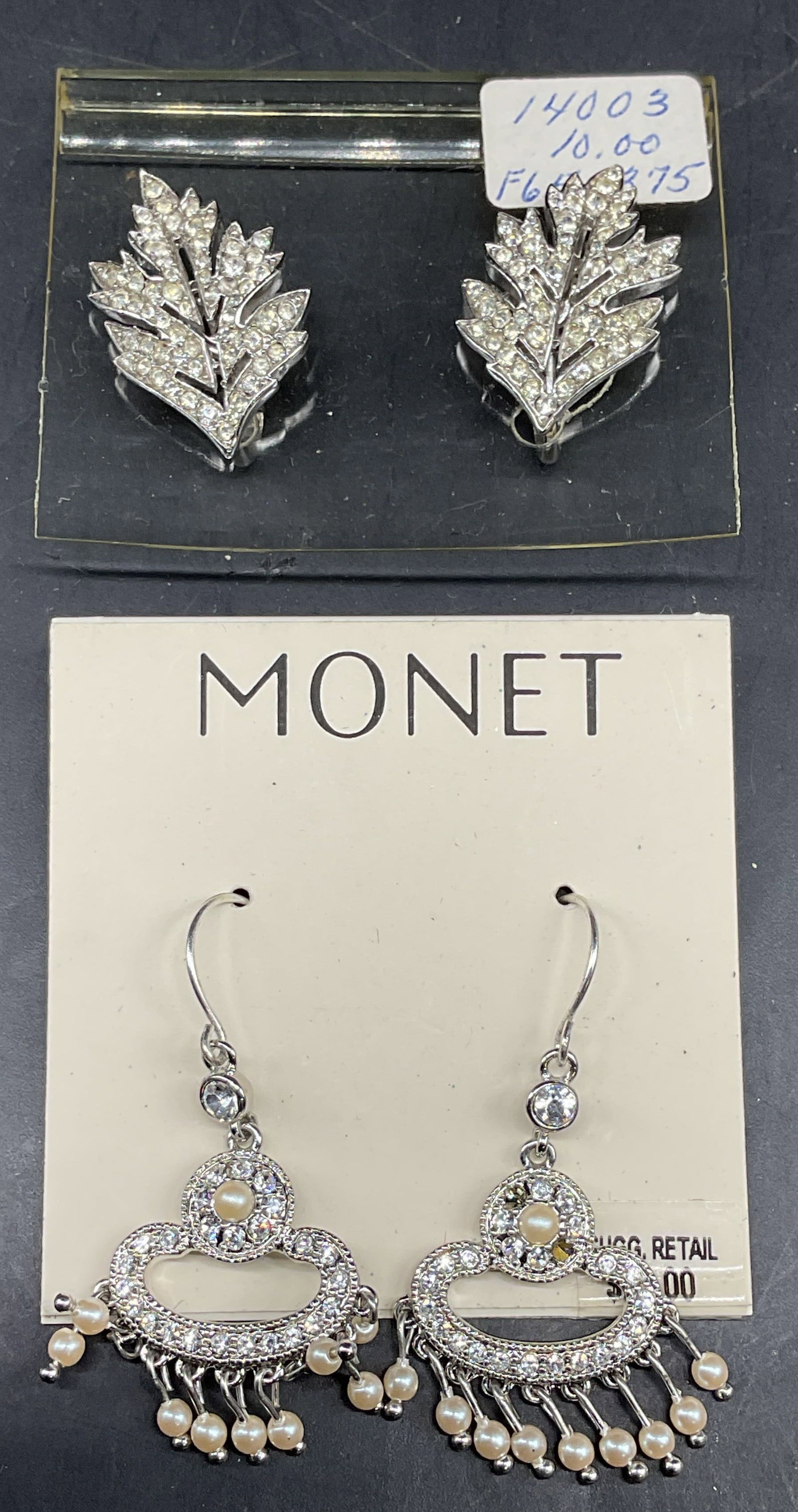 Lot 2 Trifari & Monet Rhinestone Earrings: Lot of 2 pairs of vintage Trifari and Monet silver tone rhinestone and faux pearl earrings. Monet new with tag. Larger measures approx. 1 3/8 inches long. Some scratching. Some rhinestones need replac