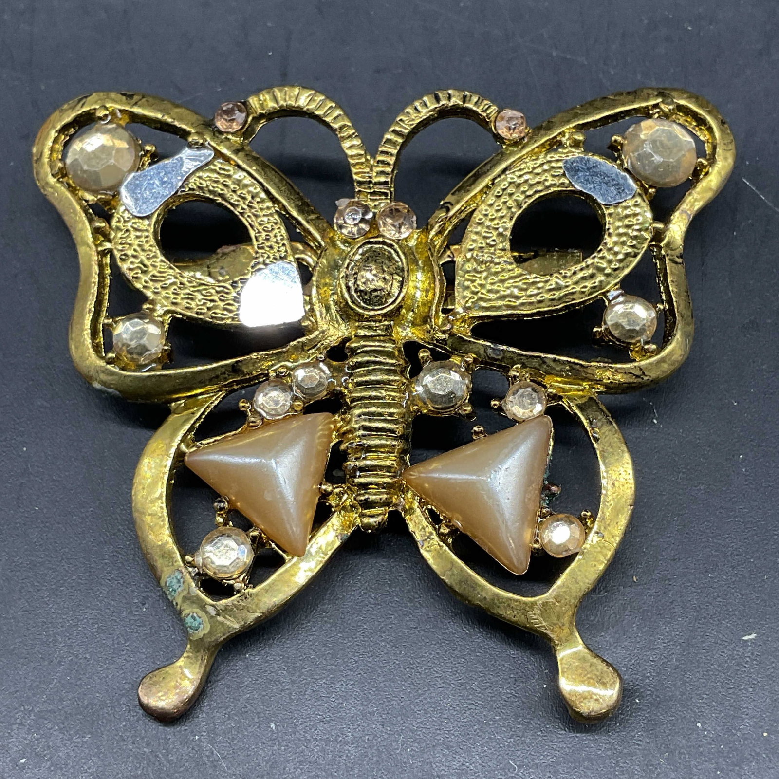 Gold Tone Rhinestone Butterfly Brooch: Vintage gold tone rhinestone butterfly brooch. Measures approx. 2.25 x 2 inches. Some rhinestones need replacement. Some scratching. Jewelry, estate jewelry, costume jewelry, cocktail jewelry, fashion