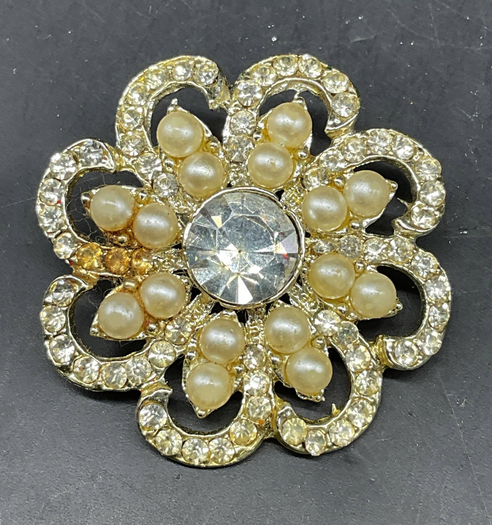 Vintage Faux Pearl Rhinestone Flower Brooch: Vintage faux pearl and rhinestone flower brooch. Measures approx. 1.5 inches wide. Some scratching. Jewelry, estate jewelry, costume jewelry, cocktail jewelry, fashion jewelry, accessories, fashion ac