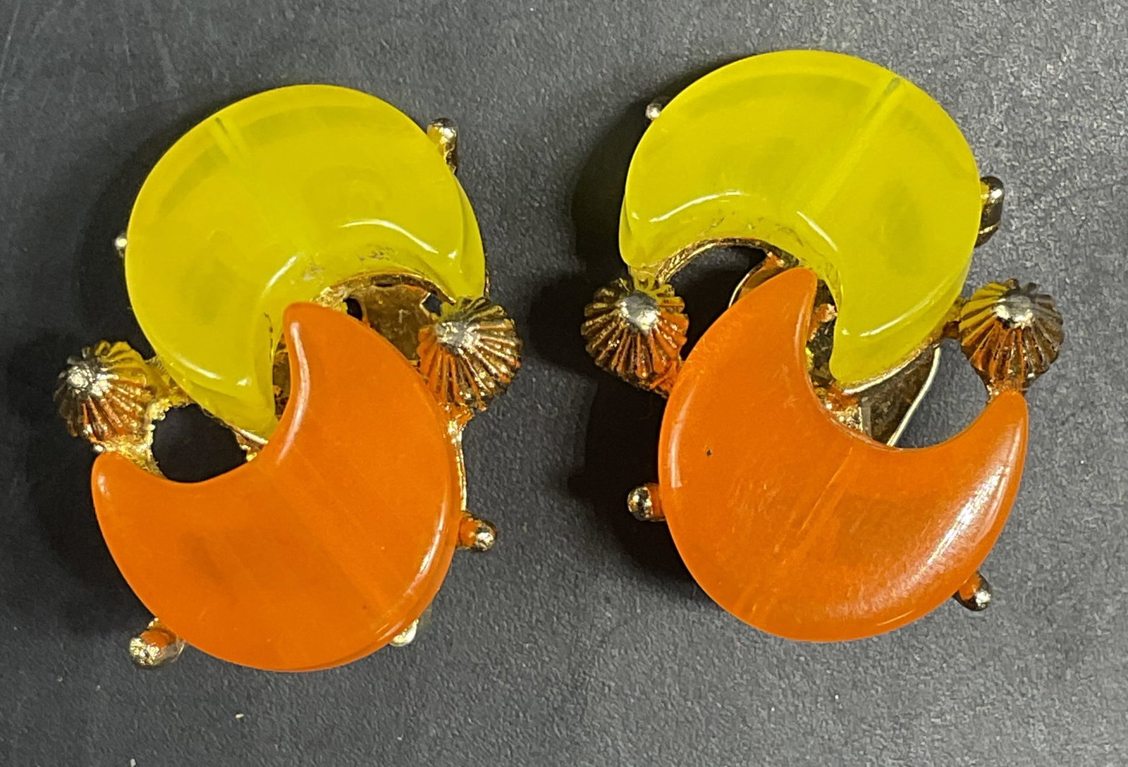 Vintage Pakula Yellow Orange Lucite Earrings: Vintage Pakula gold tone yellow and orange lucite earrings. Measures approx. 1 inch long. Some scratching. Jewelry, estate jewelry, costume jewelry, cocktail jewelry, fashion jewelry, accessories, fas