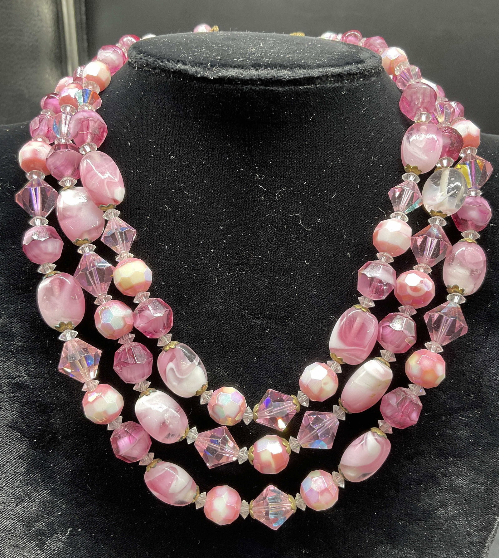 Vintage 3 Strand Pink Crystal Necklace: Vintage multi strand pink toned necklace with Faceted shaped beads, gold tone clasps and accents on beads adjustable drop length , as shown drop is app 7 inches, vintage jewelry, fashion jewelry, cost