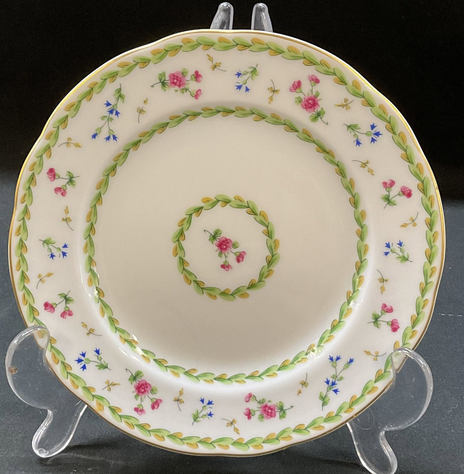 Bernardaud Limoges Artois Vert Plate France: Bernardaud Limoges Artois Vert porcelain plate. Marked on underside, made in France. Scalloped gilt edge. Floral and laurel wreath motifs in varying colors. Measures approx 7 inches in diameter. Scrat