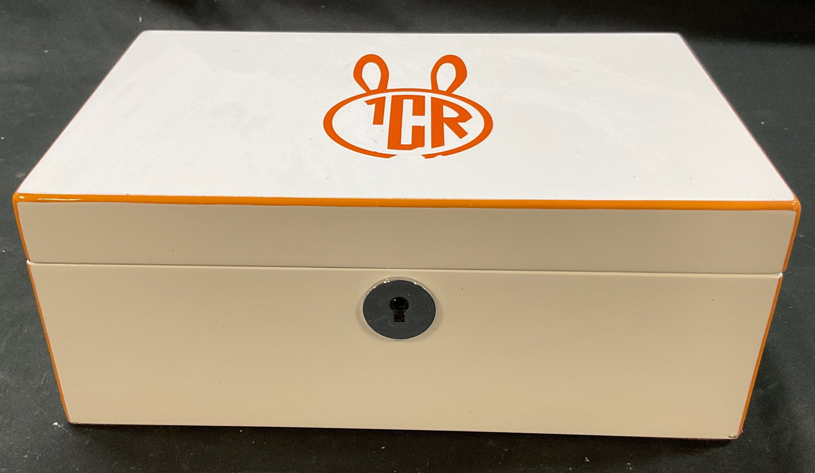 Swing Design White Lacquer Monogram Jewelry Box: Swing Design white lacquer monogram hinged jewelry box. Marked Swing Design on underside. Rectangular box with hinged lid. Orange monogram bunny design. Mirror and fitted compartments on interior.