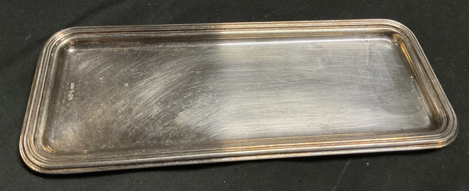 VTG 70s-80s ORLI Silver-Plated Tray ITALY: Vintage Circa 1970s-1980s ORLI Silver-Plated Rectangular Tray. Made in Italy. Scratching and Tarnishing Present. Measures app 0.25in H x 7.5in L x 3in W. Vintage Tray, ORLI, Silver-Plate, Trinket