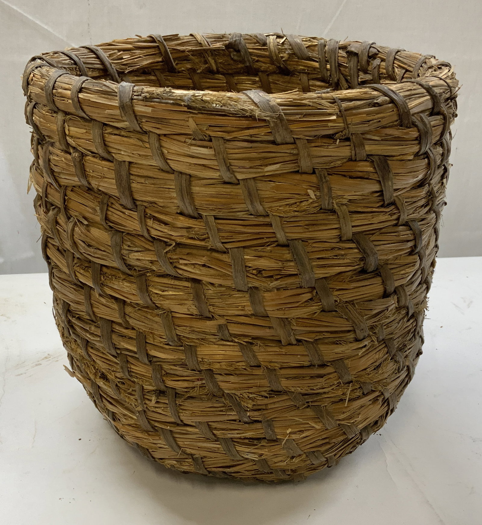 Seagrass Planter Basket: Seagrass planter basket. Rustic multi tonal brown weave. Can be used for storage or pot covers for indoor plants. Rustic home decor. Wear from age and use App 10.5 in height app 10 in diameter. Rustic