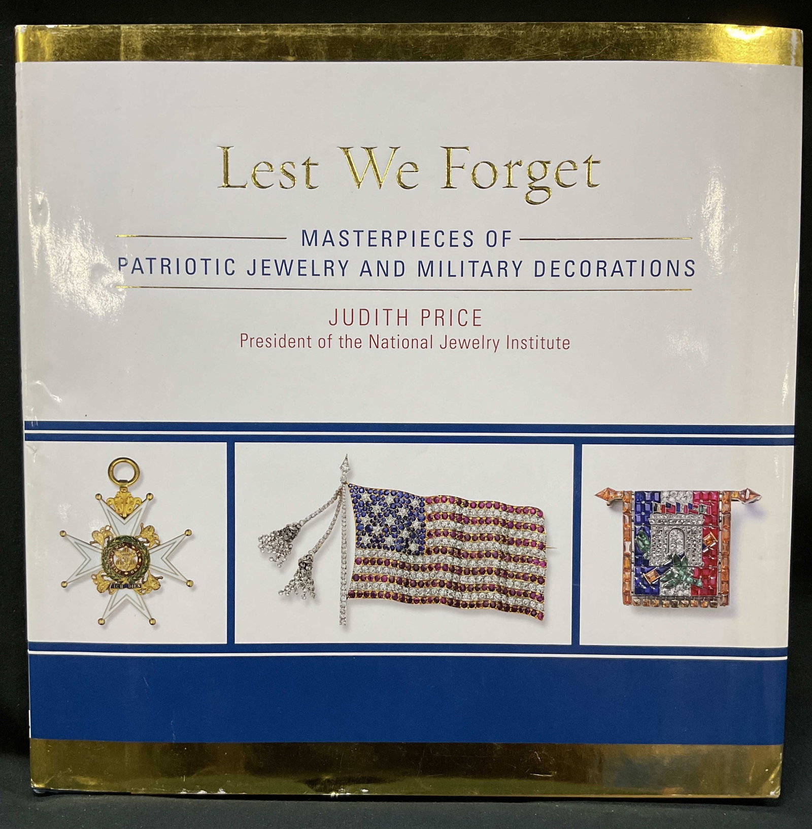 Lest We Forget, Judith Price Illus. Bk, 2011: Lest We Forget Masterpieces of Patriotic Jewelry and Military Decorations, Judith Price Published 2011 by Taylor Trade Publishing, picture book illuminating iconic military objects exploring origins a