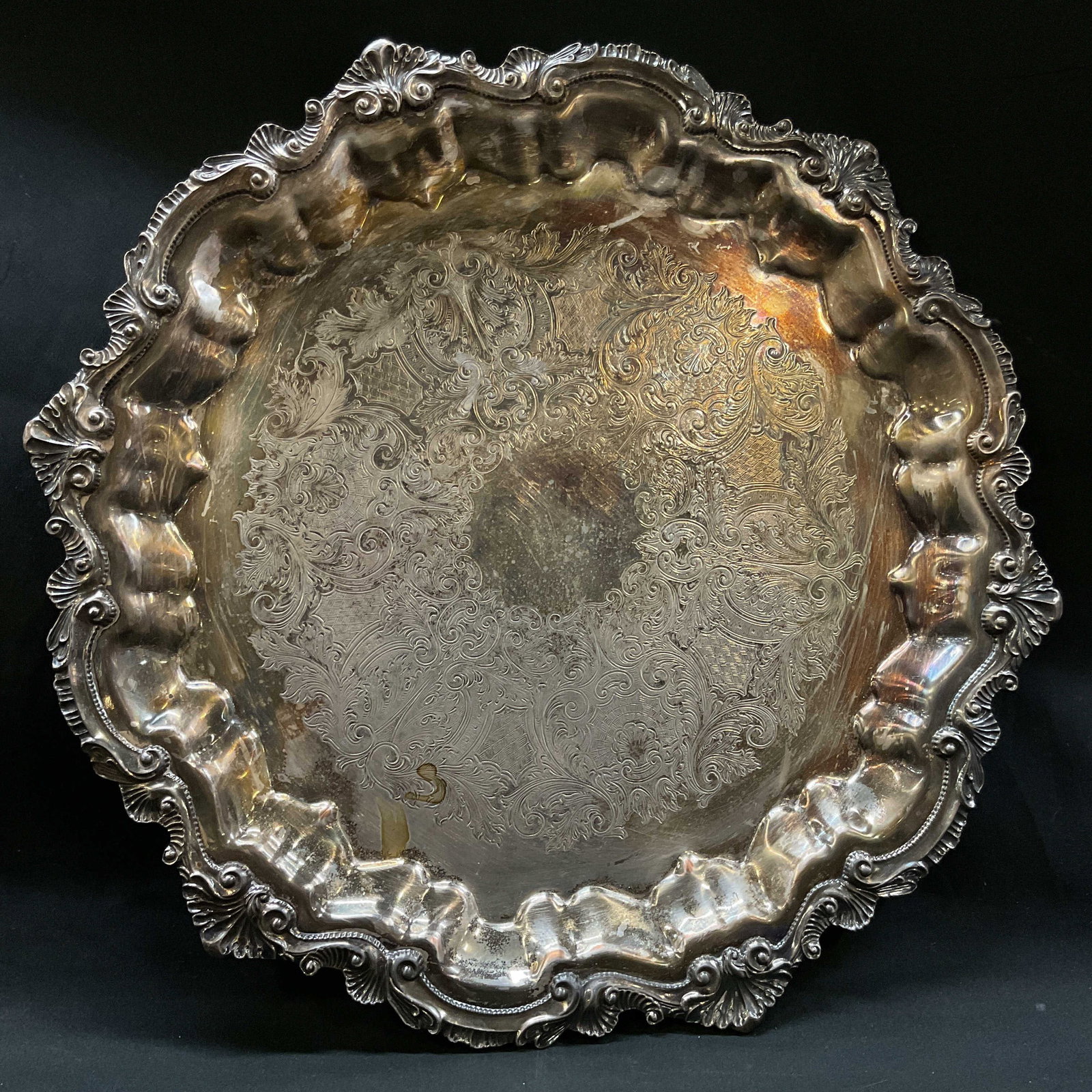 Vtg Wallace x100 SILVERPLATED Gallery Tray: Vtg Wallace x100 SILVERPLATED Gallery Tray, etched designs, three legs, approx measurements 17 in dia. 1 in H. Backside clearly marked Chippendale by Wallace x 100. Surface wear consistent with age an