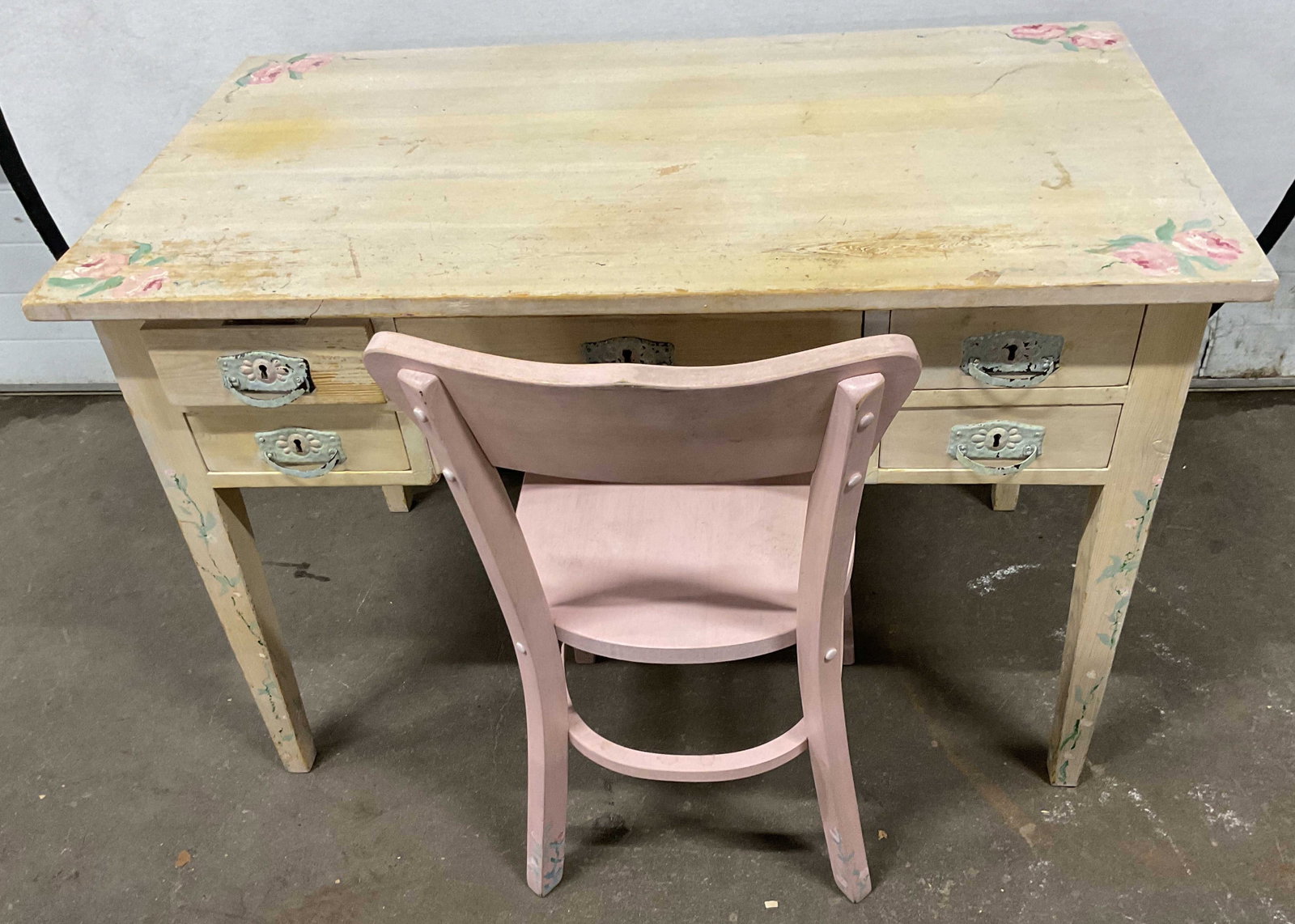 2 pcs, Vintage Hand Painted Desk and Chair: Desk hand painted roses leaves and vines, and painted hardware, with pink chair hand painted florals, desk has five drawers, four corner tapered legs, measures ht 30 inches, length 43 inches, depth 24