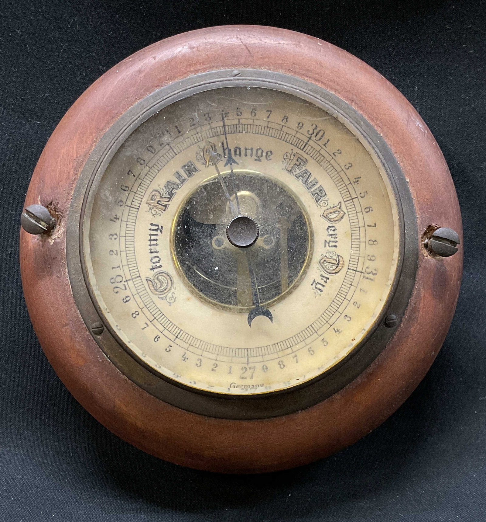 VTG. Round Wood+Brass Barometer, Germany c1950s: Vintage round mechanical aneroid barometer with a wood frame and brass accents, mid-century circa 1950s, clearly marked with numbers, dial multi-word weather scale- stormy, rain, change, fair, very