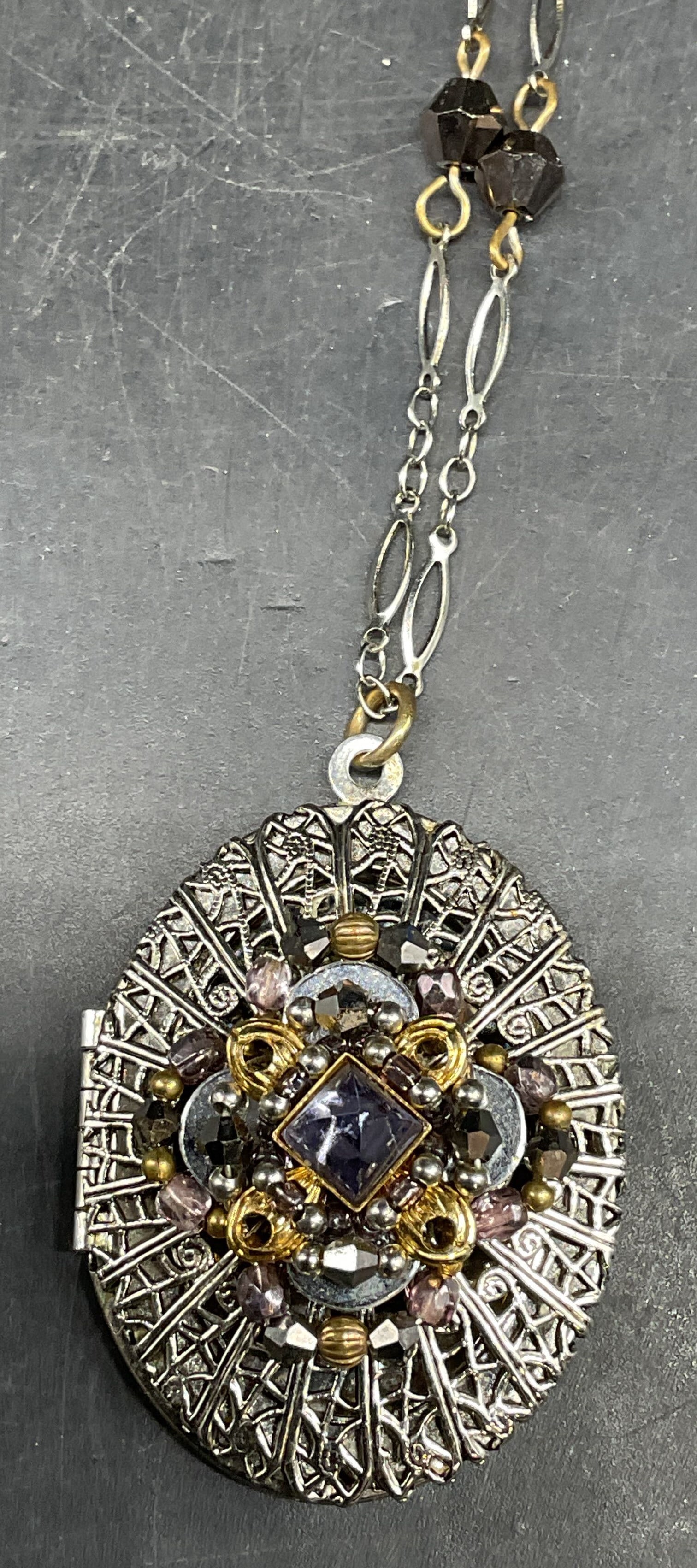 Vtg LIZTECH Silver Tone Crystal Locket Necklace: Vintage signed LIZTECH silver tone filigree crystal locket pendant necklace. Drop length approx 13.5 inches. Some scratching. Jewelry, estate jewelry, costume jewelry, cocktail jewelry, fashion jewelr