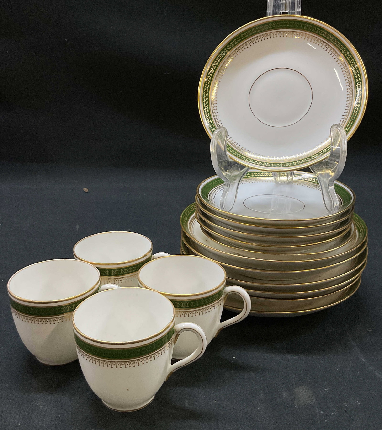 Vtg. Limoges Espresso Cup/Plate 16pc Lot, France: Vtg. WM. Guerin + Co. porcelain espresso cups and saucers. Decorated with green geometric Greek key pattern border and gilded gold trim. Set of 4 cups, 6 saucers, and 6 small plates. Approx measuremen