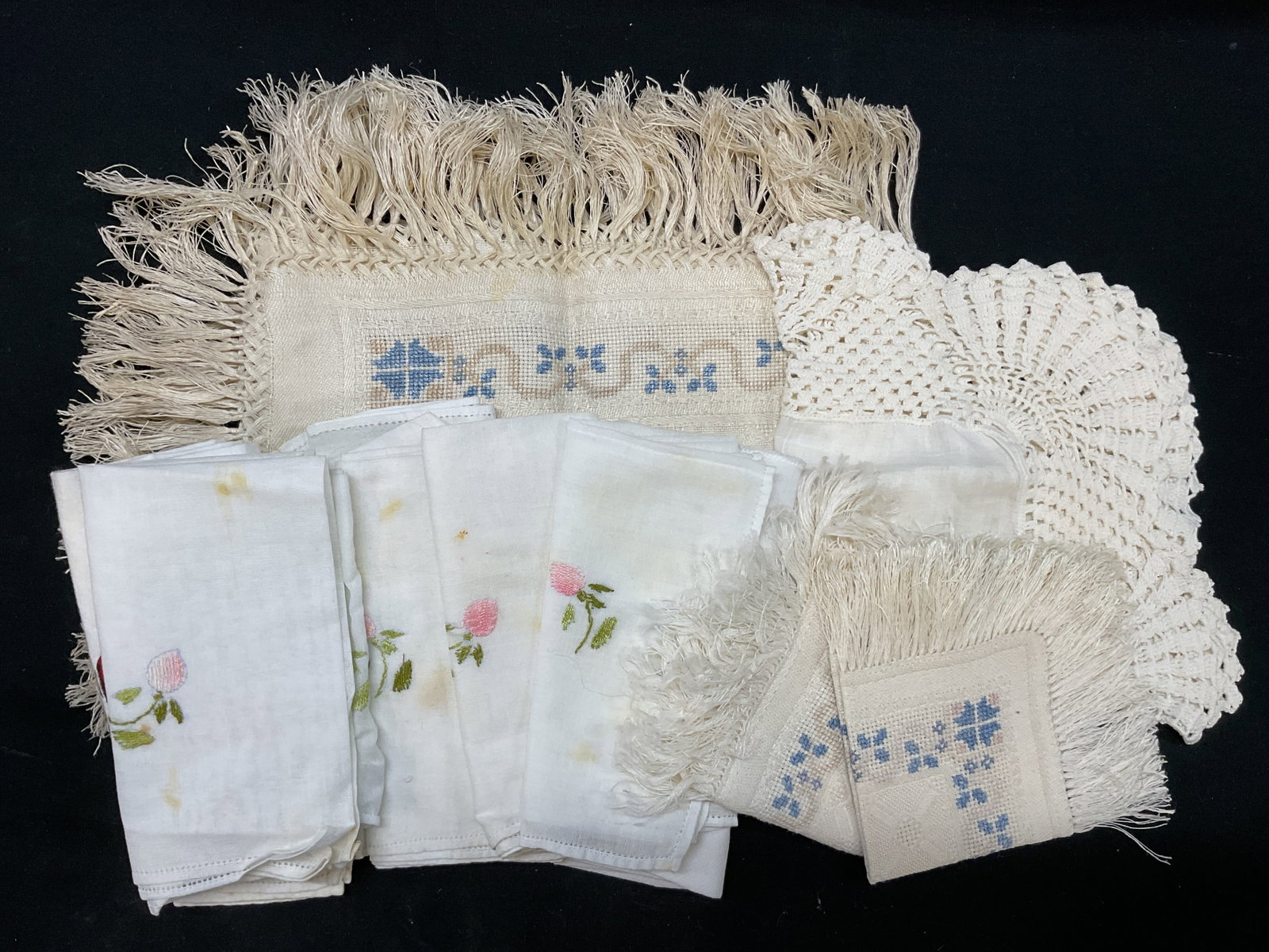 Grp Lt14 White Embroidered Linens: 14 Vintage Blue Pink White Floral Lace Linens. Blue and Pink Floral Embroidery and Lacy Edges. Includes 3 Doily, 9 Tea Napkins, Kitchen Towel with wine glasses illustration and text, and a Small Table