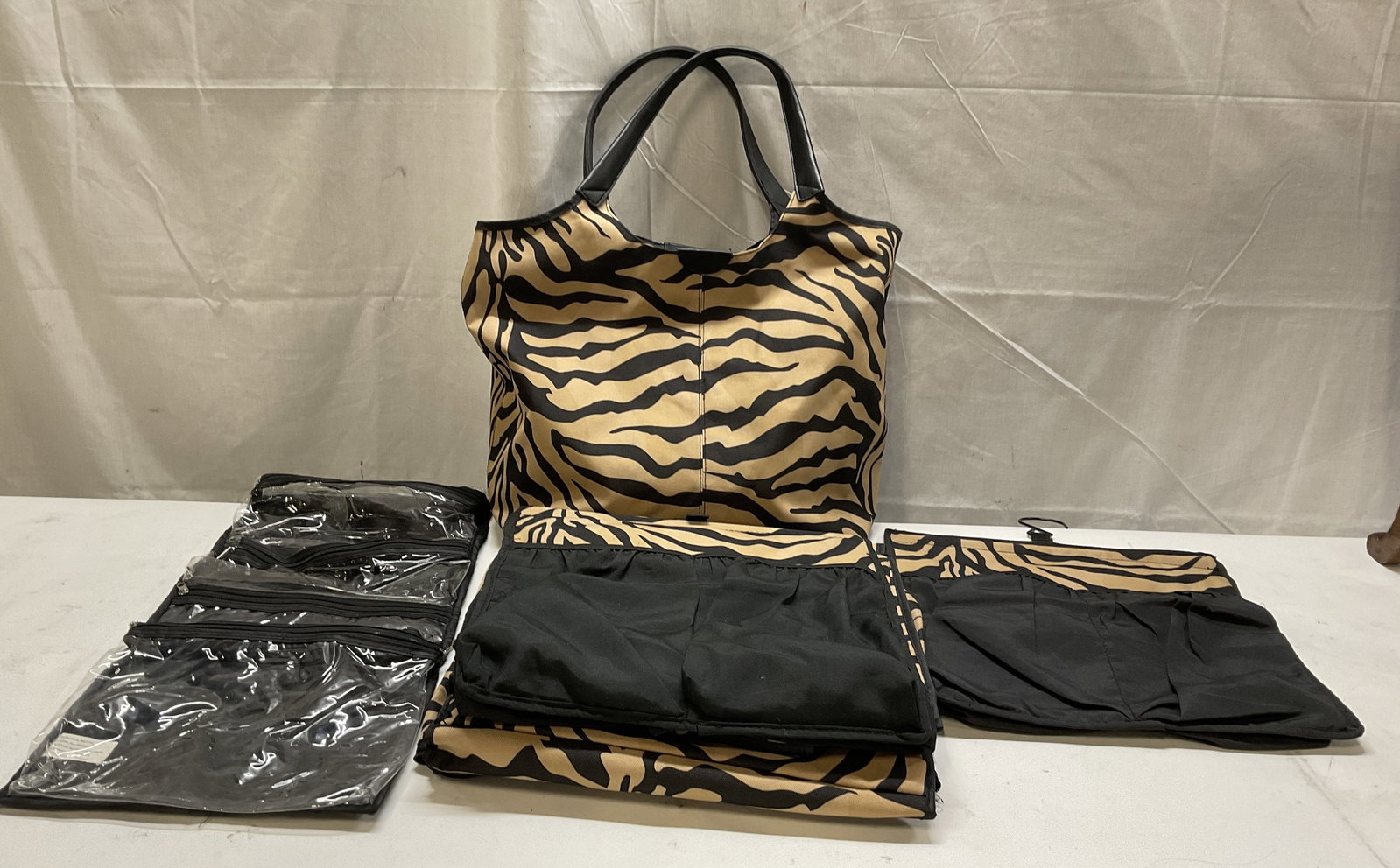 For Your Easy Only Zebra Print Travel Tote: For Your Ease Only Inc. Beige & Black Zebra Print Travel Organizer Tote. Tag reads 100% Polyester Outer Fabric and 100% Nylon Inner Lining. Comes with 4 Roll-Up Hanging Toiletry Bags with Clear Vinyl 