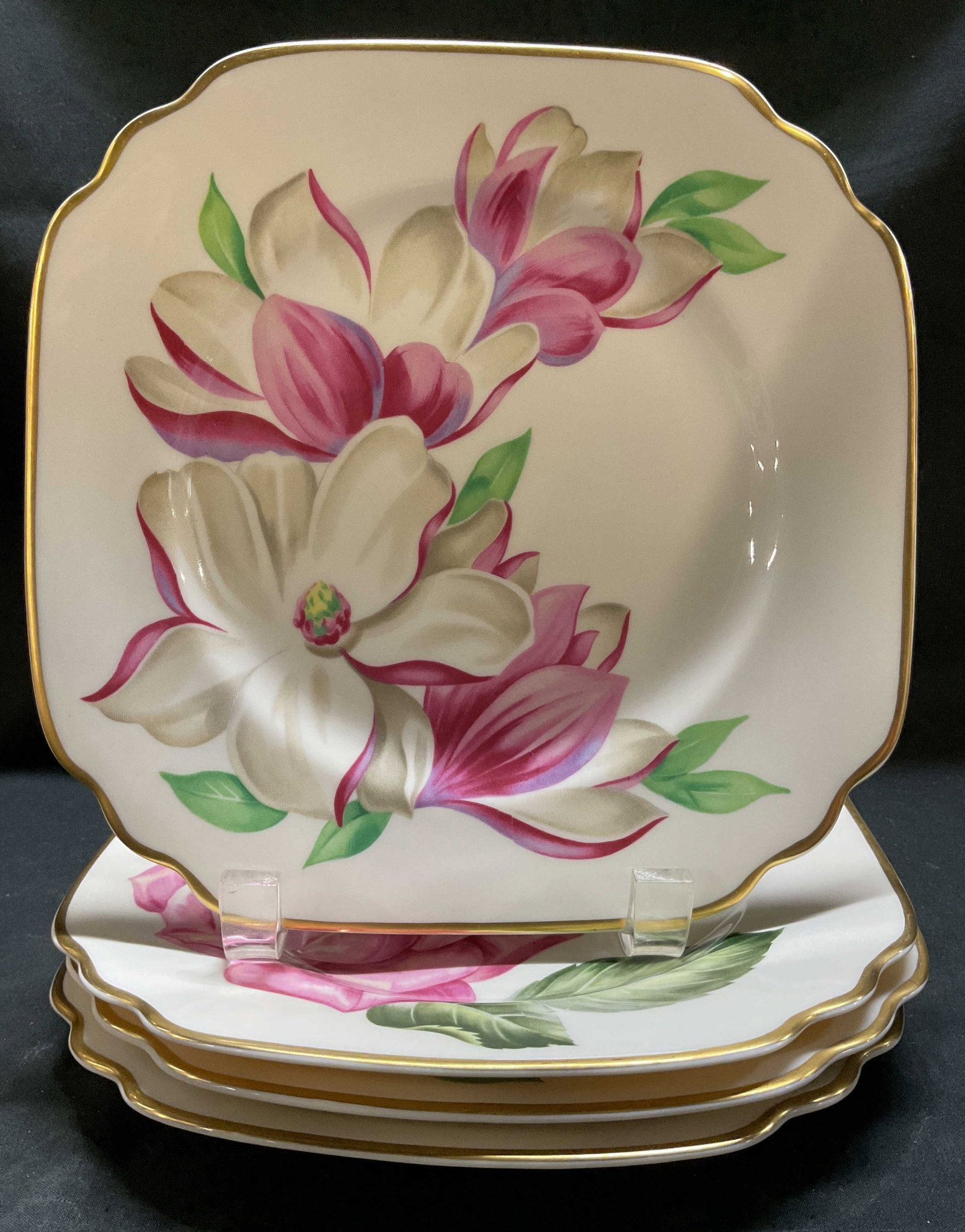 Lot 4 Onondaga Pottery Syracuse China Plates: Lot includes, 4 Ondonaga Pottery Co. china plates featuring a rose, magnolia, peony & camellia pattern. Gilt accents. Signed & marked on underside. Reads, ONONDAGA PATTERN. Surface wear consistent to 