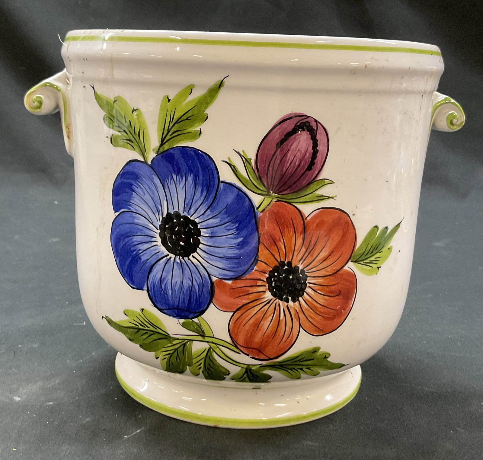 Bonwit Teller Este Painted Ceramic Planter Italy: Bonwit Teller Este hand painted ceramic planter. Marked on underside, made in Italy. Scroll handle. Short pedestal base. Hand painted floral motifs in varying colors. Green border. Measures ht approx 
