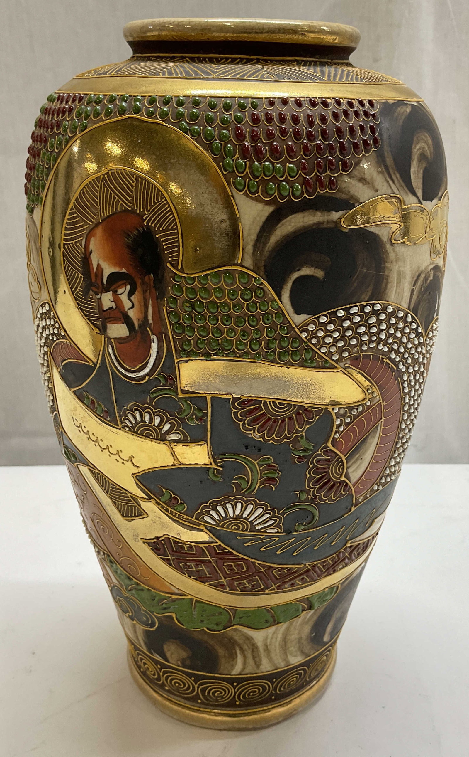 Vtg Hand Painted Japanese Satsuma Vase: Vintage Japanese Satsuma vase featuring a hand painted figure & stylized clouds. Gilt accents & raised details. Red, blue, gilt, white & green. Surface wear consistent to age, use & exposure.
