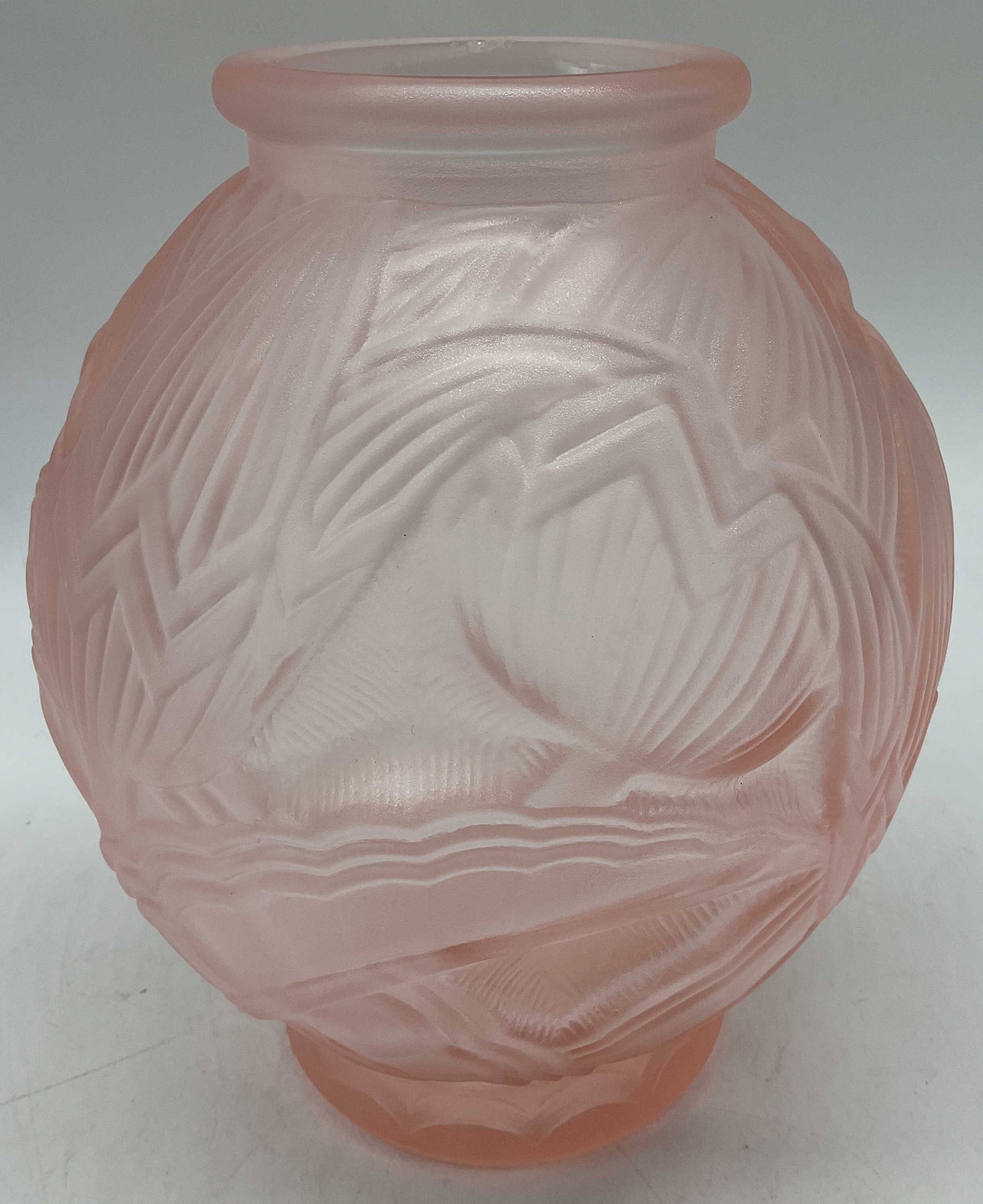 Art Deco Pink Floral Glass Vase: Art deco style glass vase featuring a detailed relief pattern of leaves & flowers. Round shape & small neck at top. No visible signature or markings. Surface wear consistent to age, use & exposure.