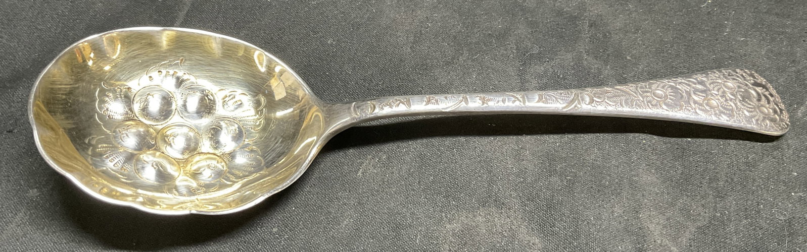 VINTAGE Silver-Plated Repousse Serving Spoon: Vintage Silver-Plated Serving Spoon. Handle Reads Stainless Nickel. High-Relief Berry Designs on Bowl. Repousse Floral Designs on Handle. Wear to Plating and Scratching Present. Measures app 6.75in H
