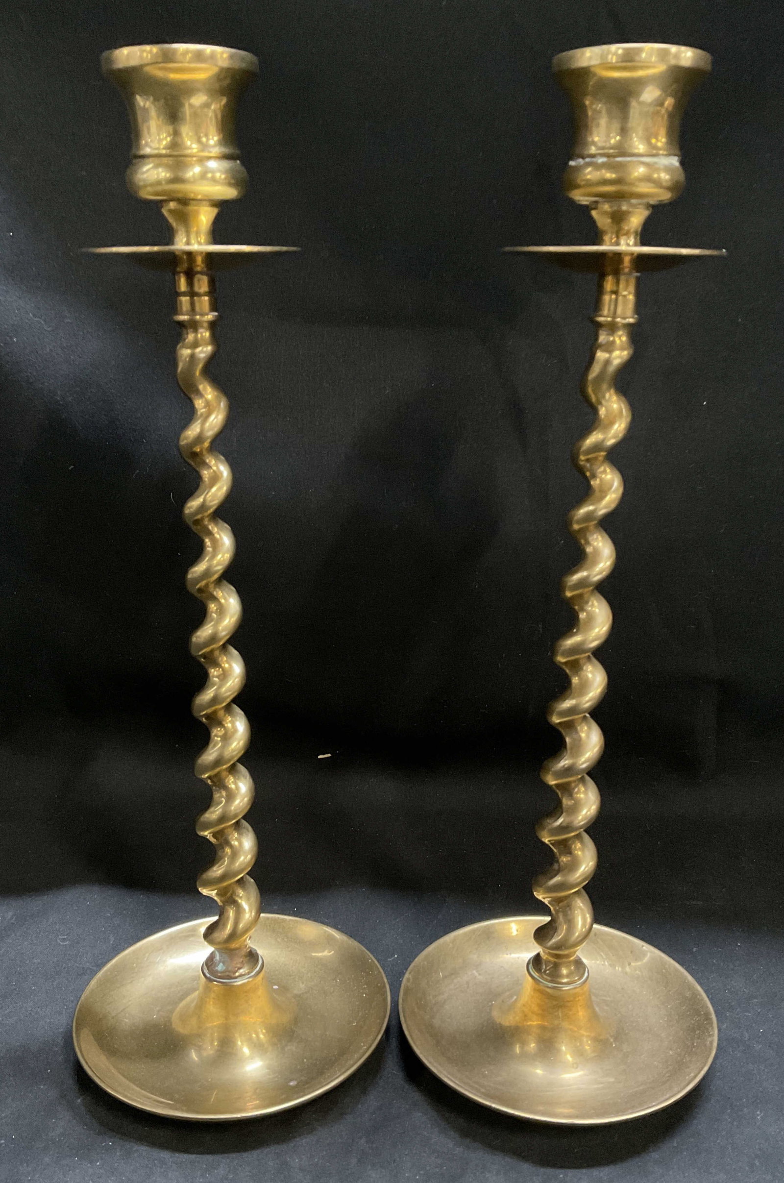 Pair VTG Twisted Stem Brass Candlestick Holders: Pair of Vintage Solid Brass Candlestick Holders with Barley Twist Stem Designs. Scratching, Oxidization, and Wax Residue Present. Measures app 10.75in H x 3.5in Diam. Vintage Candlestick Holders,