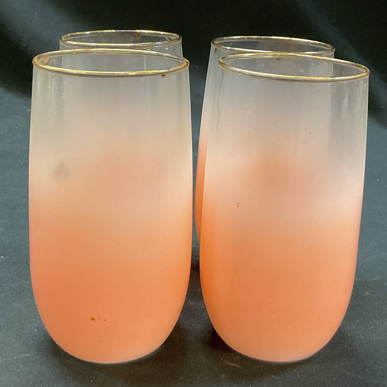 Set 4 Blendo Pink Frosted Glasses: Set of 4 Blendo pink frosted glasses. Bulbous body with pink frosted design. Gilt rim. Measures ht approx 5 inches diam approx 2.5 inches. Scratching and residue. Glasses, stemware, tableware, home