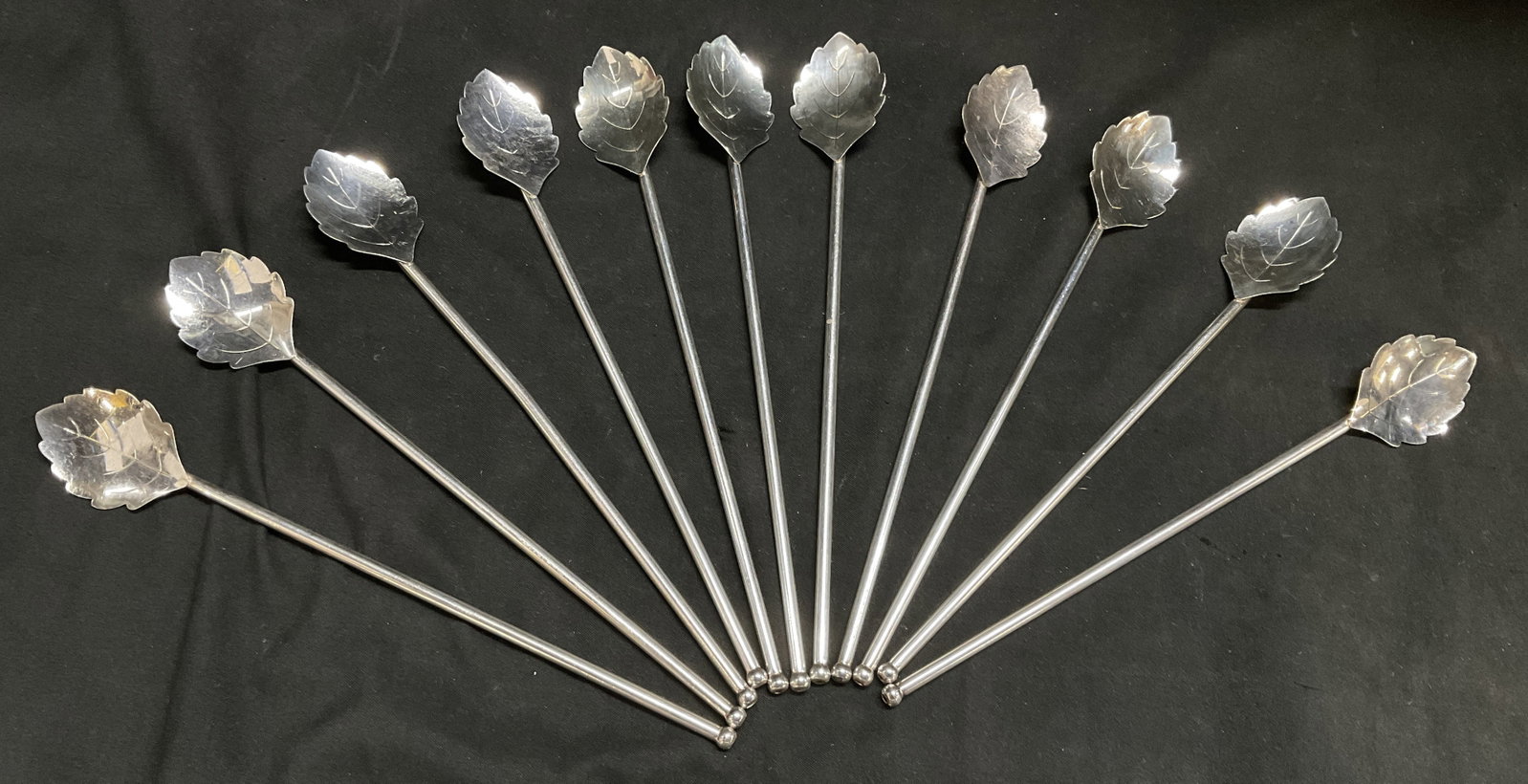Lt11 VTG Slvr-Pld Leaf-Shaped Sipper Spoons DENMK+: 11 Vintage Silver-Plated Leaf-Shaped Sipper Spoons. Finial Balls at Top. Made in Denmark. 10 Marked with Whale Makers Mark and Denmark. One is Marked DD 90 Which Indicates a High-Quality Heavy Plate. 