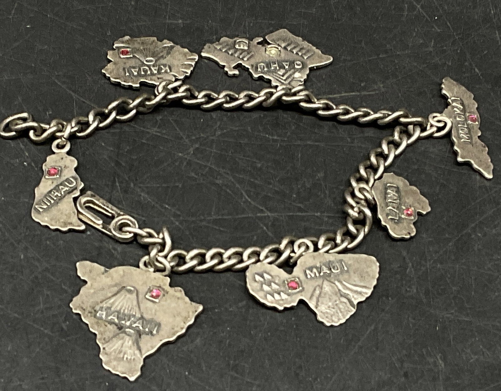 VTG 40s-50s STERLING Charm Bracelet HAWAII: Vintage Souvenir Charm Bracelet. Sterling Silver Charms and Clasp. Made in Hawaii Circa 1940-1950s. Features Individual Die-Cut Maps of Hawaiian Islands Niihau, Kauai, Oahu, Molokai, Lanai, Maui, and 