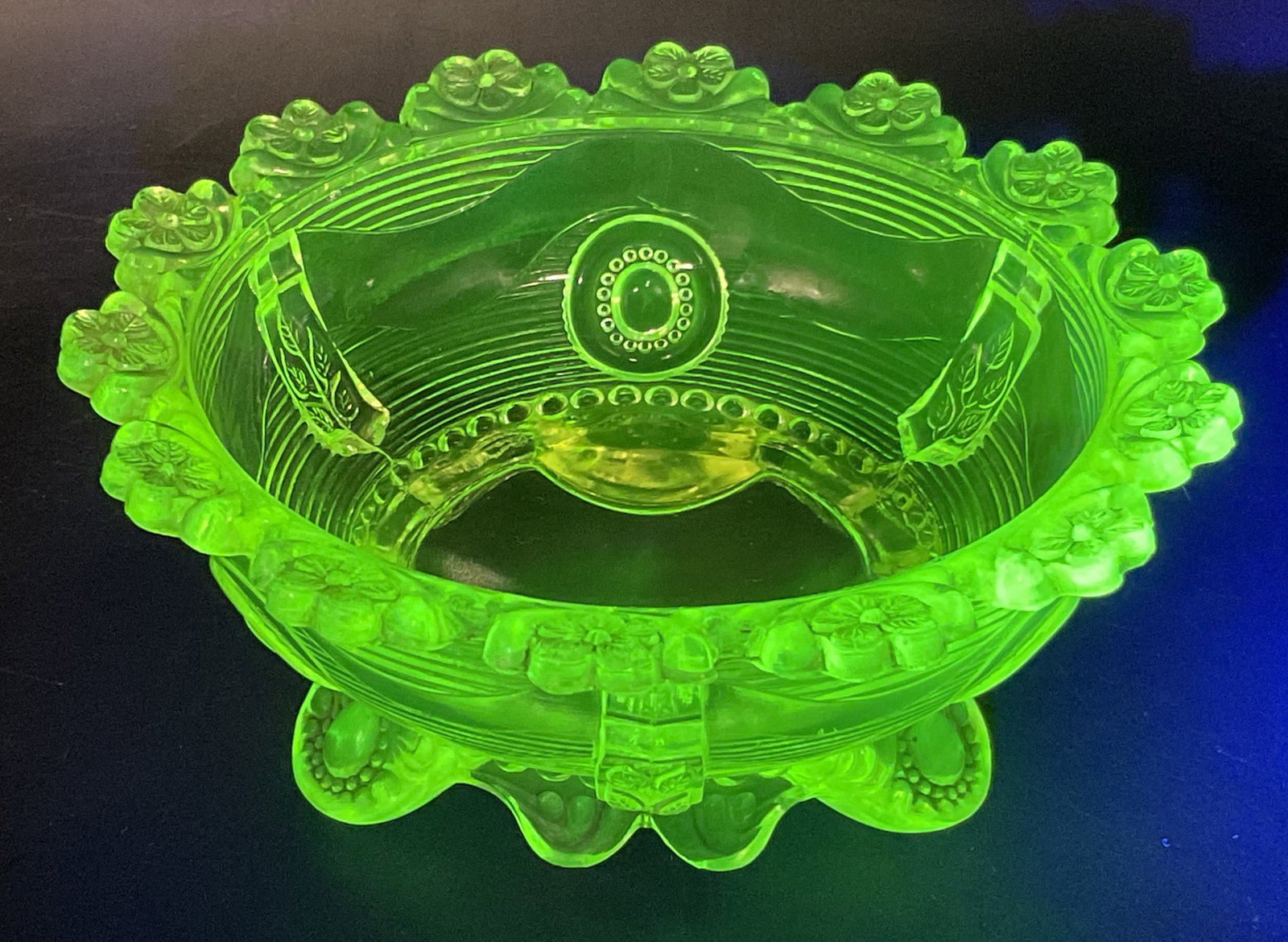 ANTQ Indiana Uranium Glass Berry Bowl: Antique Circa 1890 Early American Pattern Glass Uranium Glass Footed Berry Bowl. Made by Indiana Glass Company. Dewey Pattern. Decorative Flowers on Scalloped Rim. Leaves and Circular Patterns on Side
