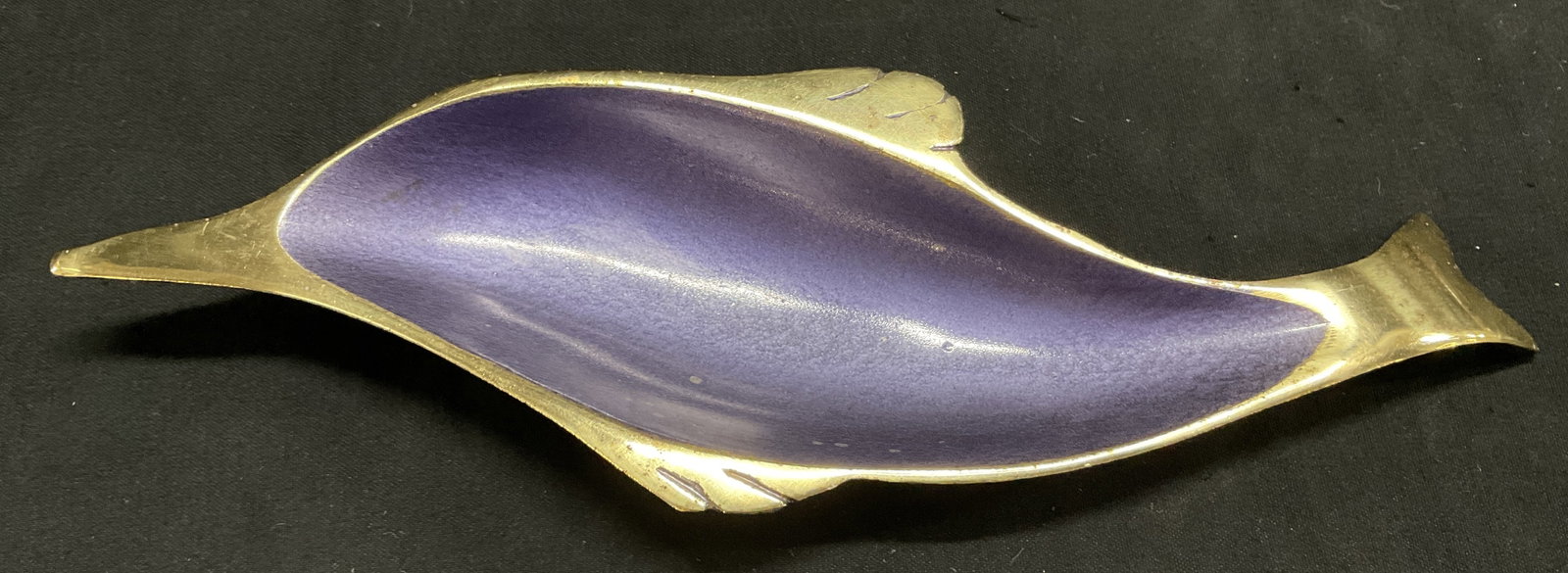 MCM Brass &Enamel Dolphin Trinket Dish ISRAEL: Mid-Century Modern Brass and Purple Enamel Dolphin Trinket Dish. Export Quality Made in Israel. Chips in Enamel, Scratching, and Aging to Metal Present. Measures app 1in H x 8in L. Mid-Century