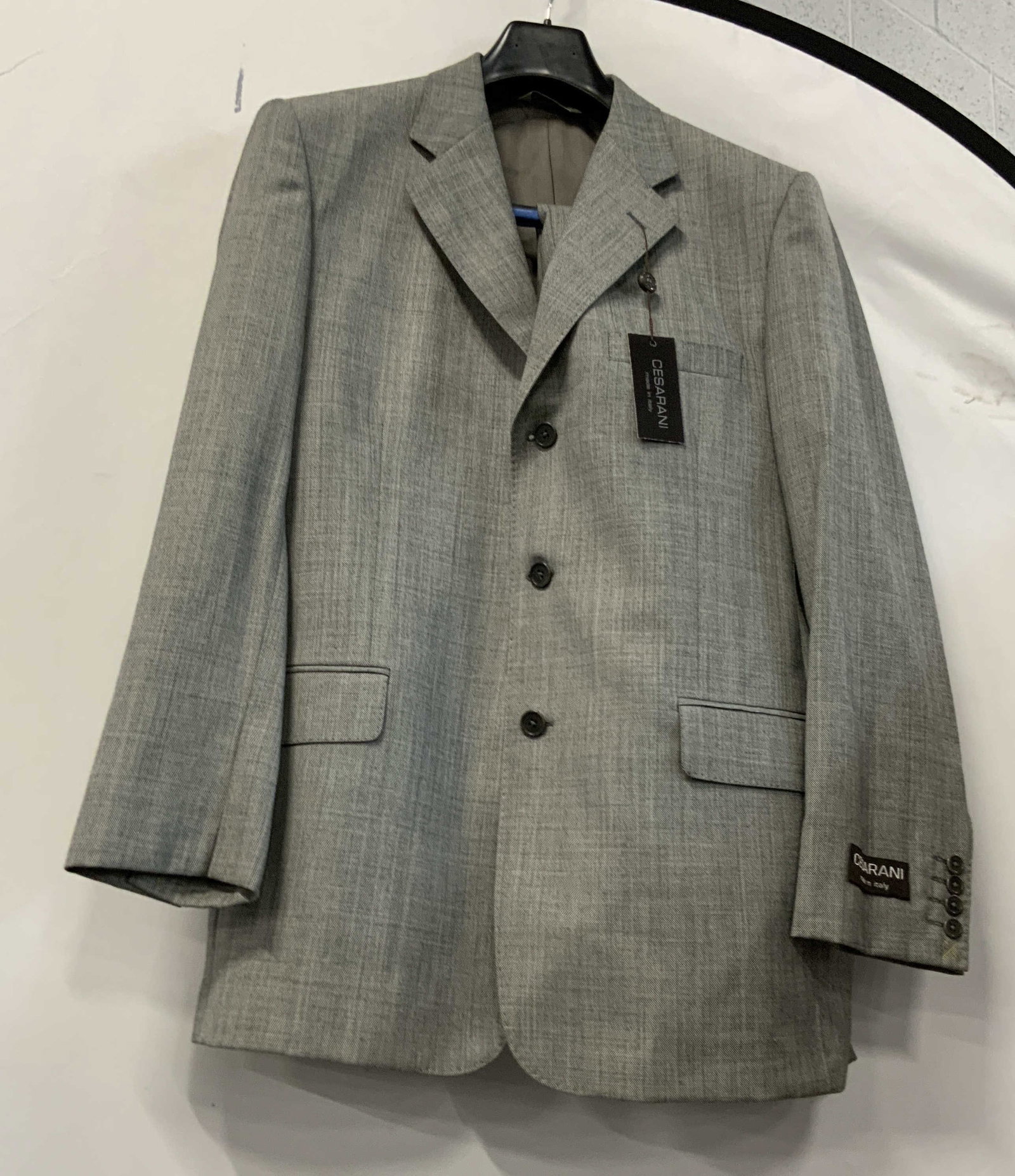 Cesarani made in Italy grey suit NWT: Cesarani grey suit jacket and pants. Made in Italy using 100% wool material. Jacket size 40 pants size 34w. Jacket features yellow stitching on the shoulders, 3 inner pockets as well as 3 exterior