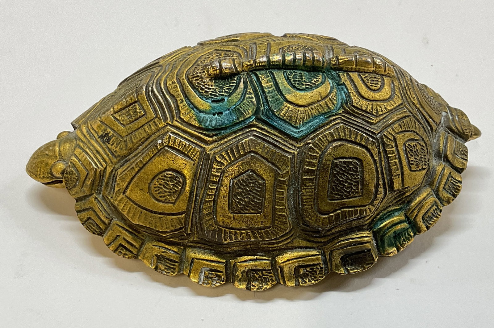 Vtg. 1994 MET Museum Turtle Paperweight: Vintage 1994 Metropolitan Museum of Art Gilt Turtle Paperweight. Gold colored finish over cast metal base. Underside clearly stamped 1994MMA. measures approx. 4 x 3in Surface wear consistent with age