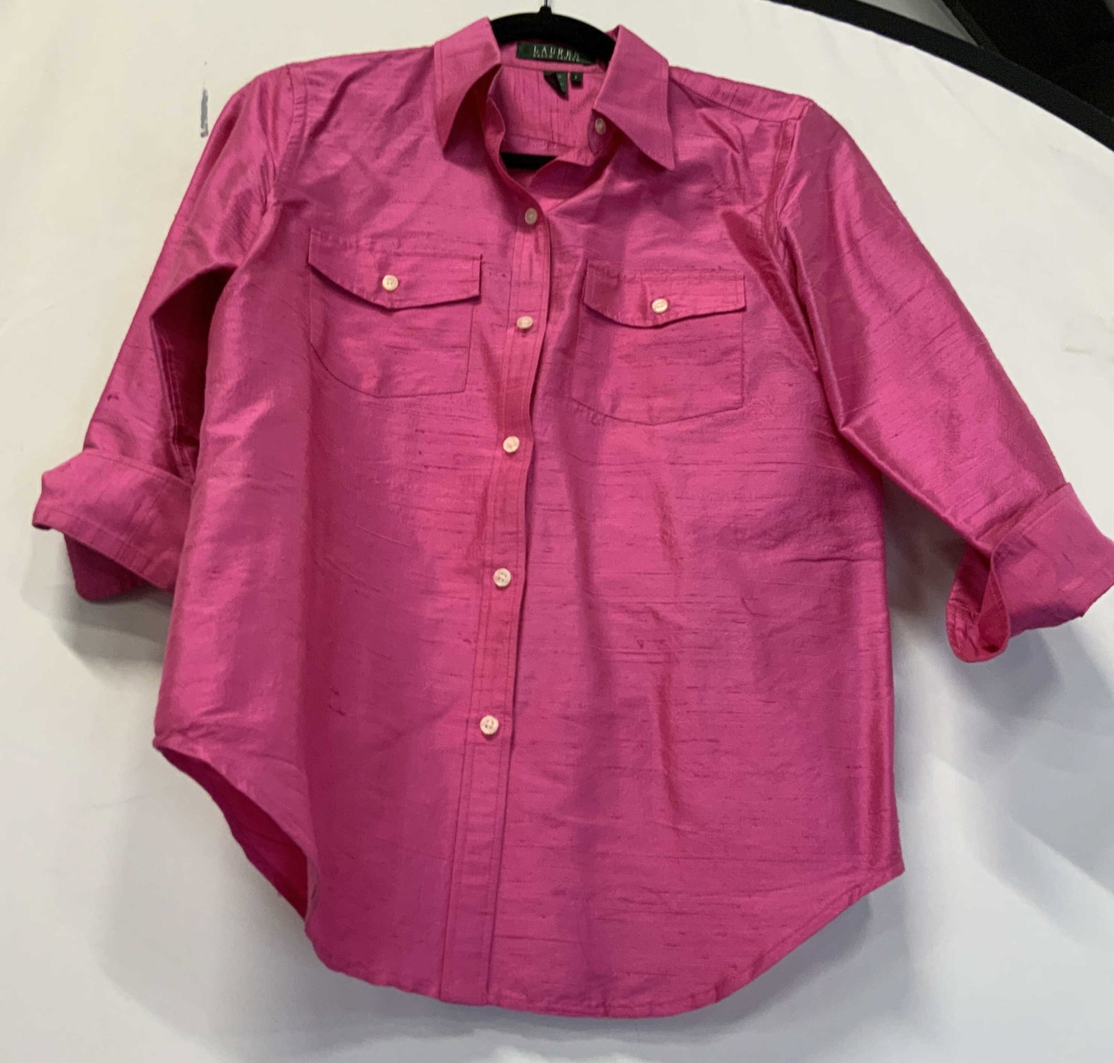 Ralph Lauren pink silk button down: Ralph Lauren pink silk button down. 3/4 sleeves with open cuffs to create a rolled look. 100% linen size small. 2 chest pockets. Distressed textured design through the whole shirt. Staining on the