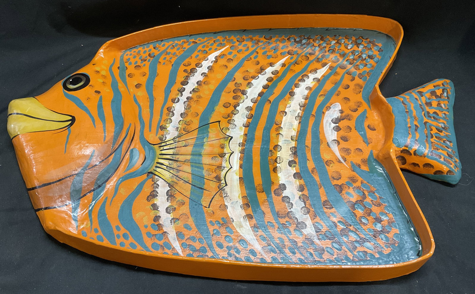 Hand-Painted Tropical Fish-Shaped Platter THAILAND: Colorful Tropical Fish-Shaped Platter. Orange with Teal Stripes, Black Polkadots, and Yellow Accents. Hand-Painted in Thailand. An Exclusive Import of Habitat International. Cracks Present. Measures