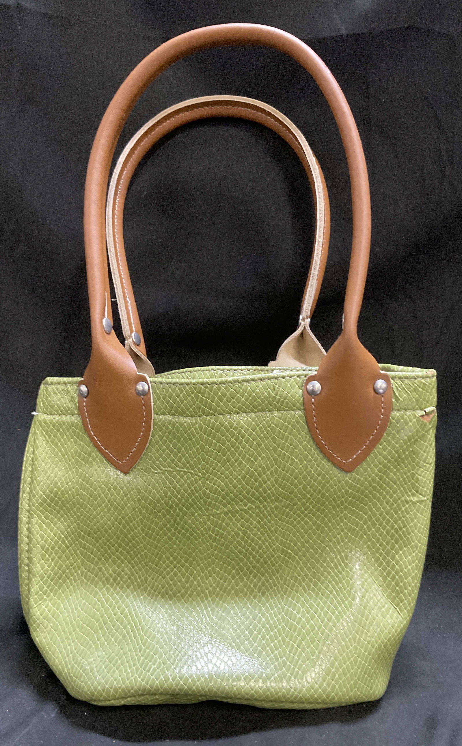 Au Green Snakeskin Leather-Style Handbag: Light Green Snakeskin Leather-Style Handbag. Brown Leather-Style Handles. Pink Nylon Interior. Inner Tag Reads Au TM. Creasing and Tears Present. Measures app 15.25in H x 9.5in L. Green, Leather-Style