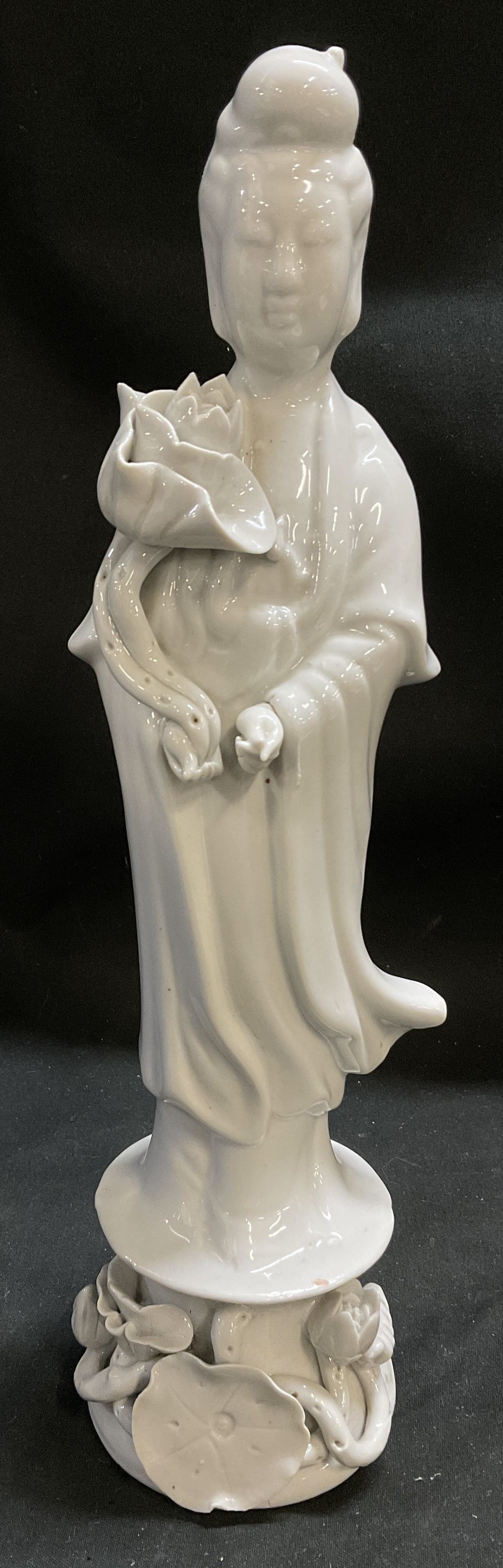 VTG Chinese Blanc de Chine Porcelain Goddess Fig: Vintage Chinese Blanc de Chine Porcelain Goddess Holding Lotus Flower Figurine. Intricately Wrapped High-Relief Floral Pedestal Base. Condition Consistent With Exposure. Measures app 10in H x 2.75in L