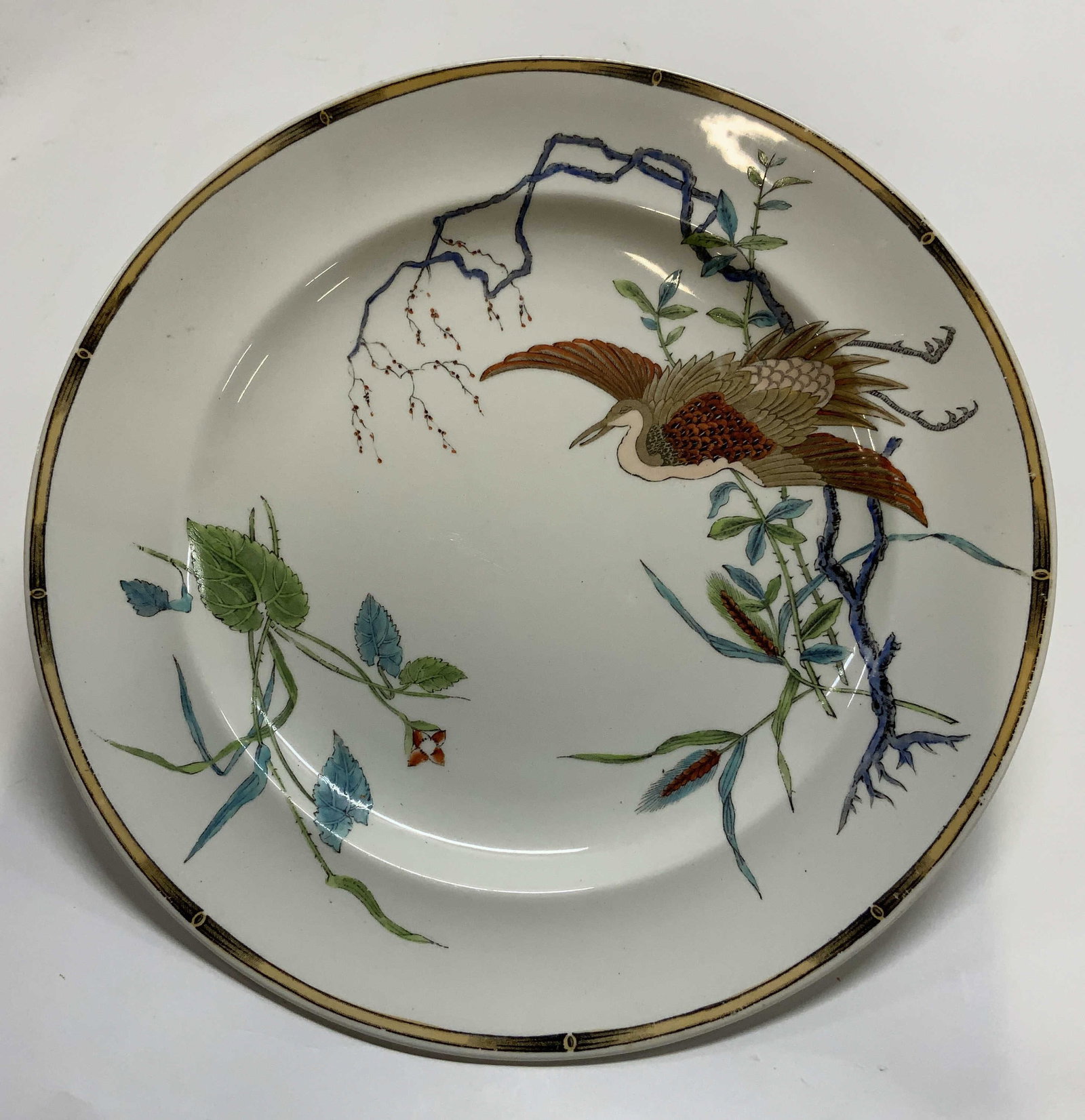Antq Royal Worcester Egret Dinner Plate, England: Antique Royal Worcester Egret Dinner Plate. Made in England. Influenced by Traditional Japanese art. Egret or crane with orange and brown plumage perched on blue branch, outer edge bordered by geometr