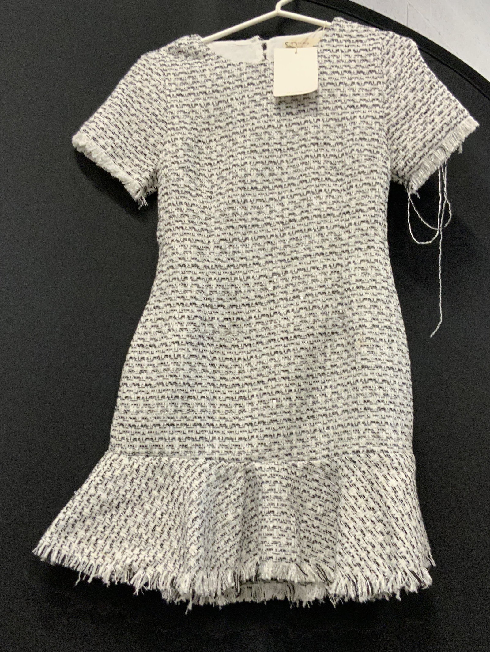 Fanco tweed dress NWT: Fanco tweed dress. New With Tags. Dress features a black and white tweed pattern, open back design with a fringed hem. Dress is mini length ,has short sleeves and a zipper closure as well as pearl