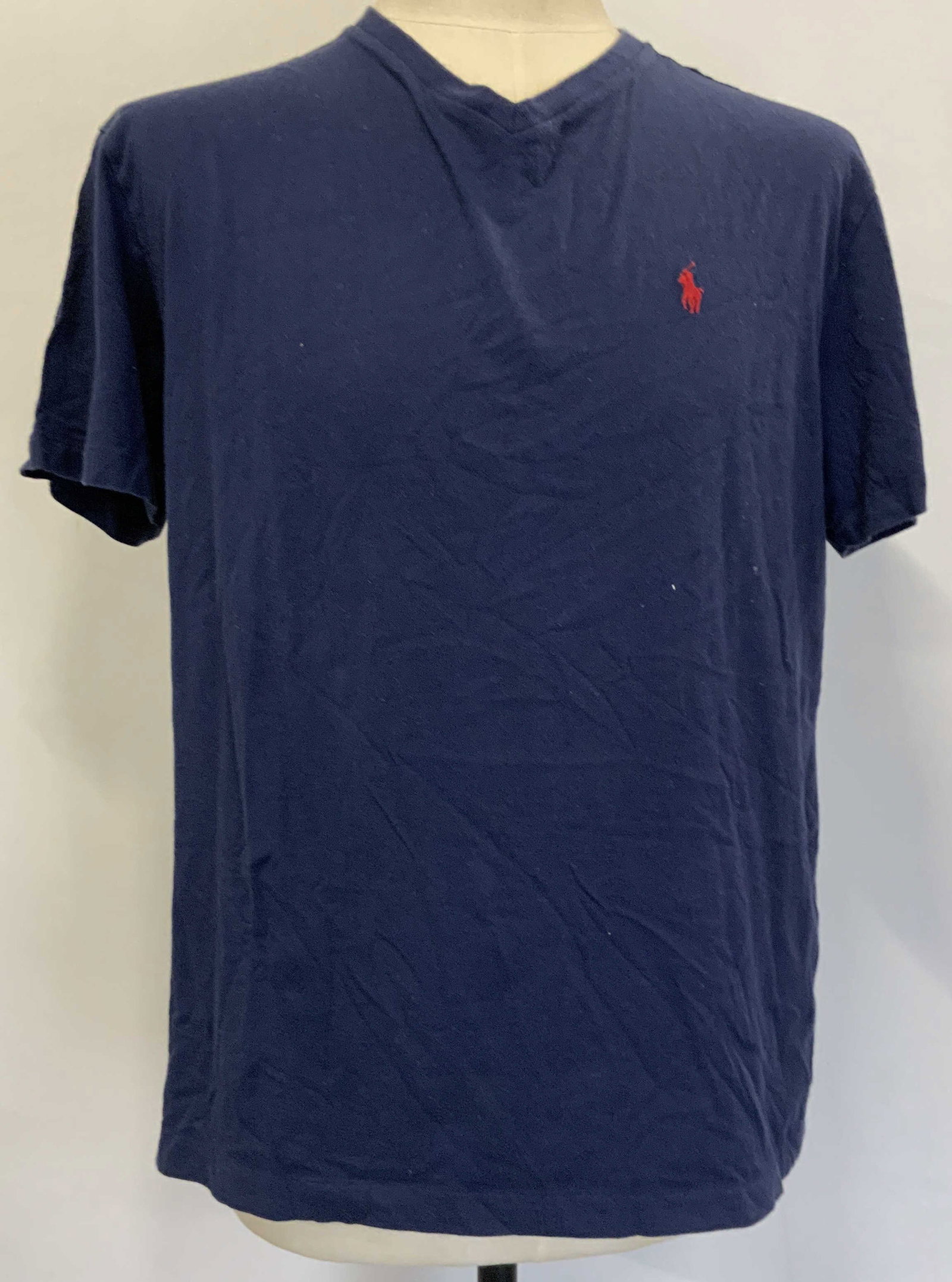 Polo Ralph Lauren tee shirt: Polo Ralph Lauren tee shirt. Navy blue 100% cotton tee shirt. Features a v neck design, short sleeve, and a red embroidered Polo logo. Fashion, Polo H11